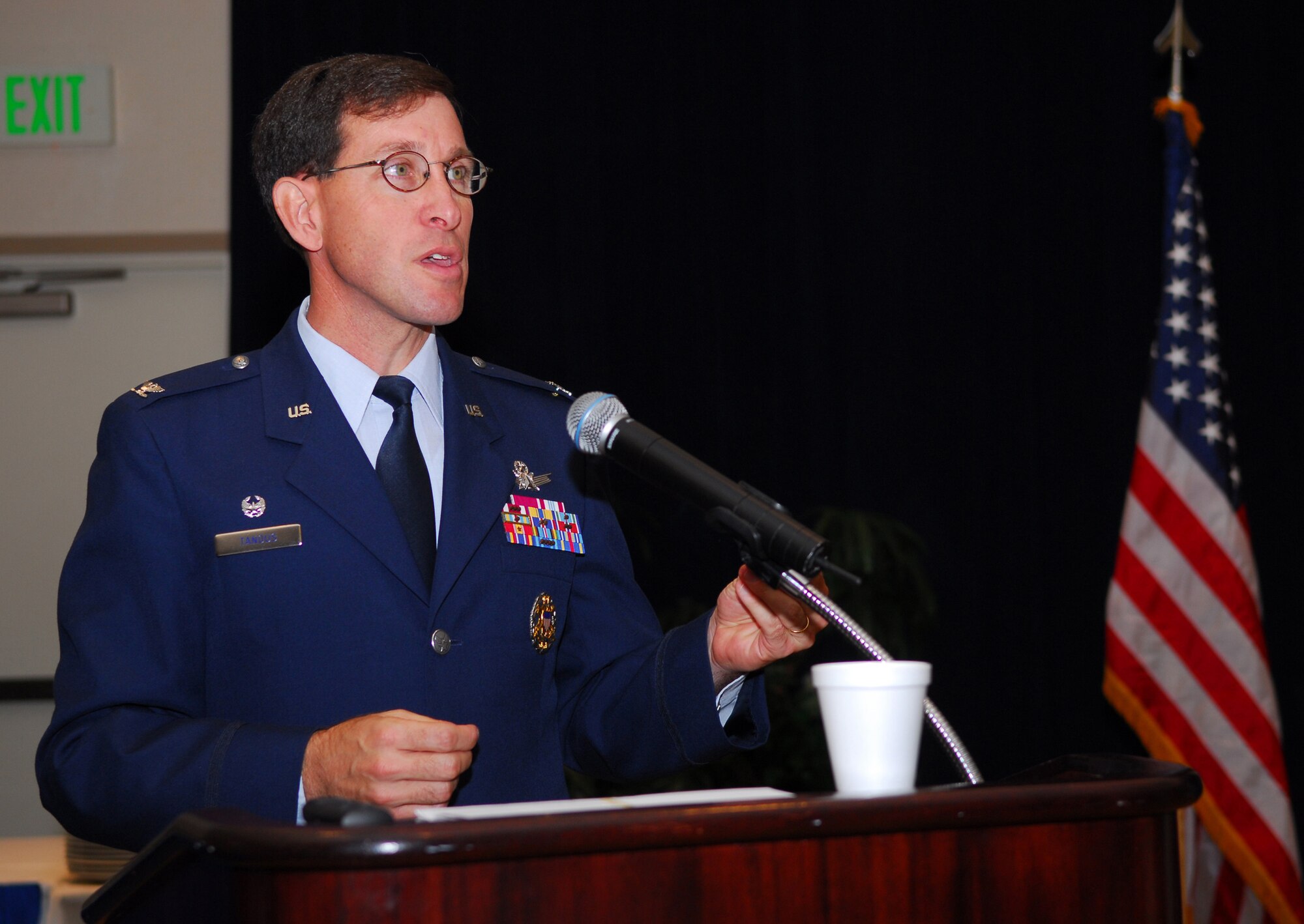 VANDENBERG AIR FORCE BASE, Calif. -- Col. Steve Tanaus, commander of the 30th Space Wing, pays tribute to POWs, MIAs and retirees during the opening of the annual Retired Member Appreciation Day in the Pacific Coast Club on Nov. 9. The event is held to recognize the contributions of retired military members, including those who served on active, guard and reserve duty. (U.S. Air Force Photo/Airman 1st Class Ashley Tyler)