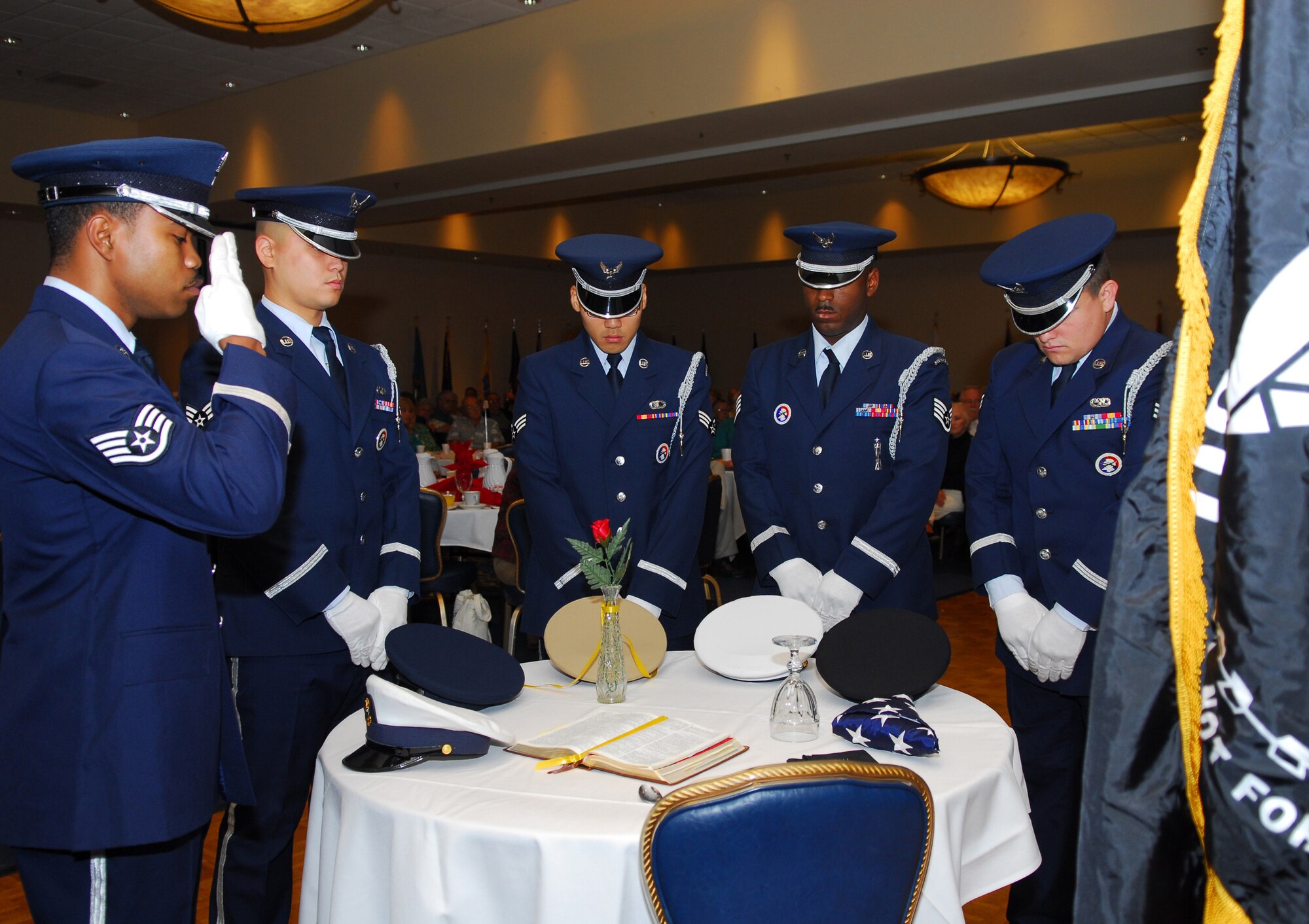 VANDENBERG AIR FORCE BASE, Calif. -- Honor guardsmen pay tribute to POWs and MIAs during the opening of the annual Retired Member Appreciation Day in the Pacific Coast Club on Nov. 9. The event is held to recognize the contributions of retired military members, including those who served on active, guard and reserve duty. (U.S. Air Force Photo/Airman 1st Class Ashley Tyler)