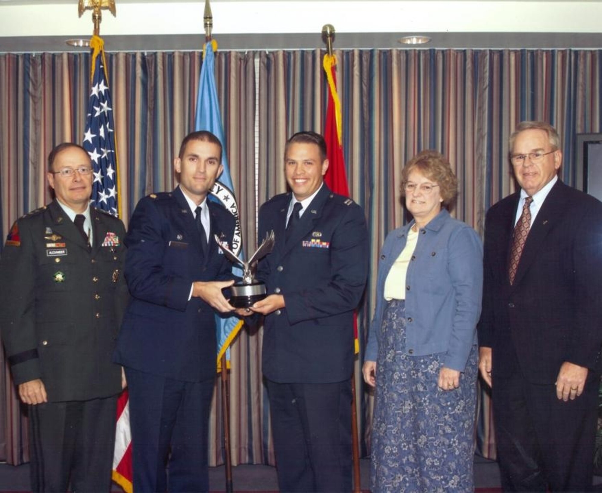 (L-R): Army Lt. Gen. Keith Alexander, DIRNSA & JFCC-NW, poses with Air Force Maj. Carl Grant,  33rd Network Warfare Squadron commander, Air Force Capt. David Trollman, AF Network Prevention & Response Flight flight-commander, Ms. Joan Ruhl, NSA deputy information assurance director, and Thomas Rowlett, son of Frank B. Rowlett, after presenting the Frank B. Rowlett Award for Outstanding Information Assurance Organization. (courtesy photo)
