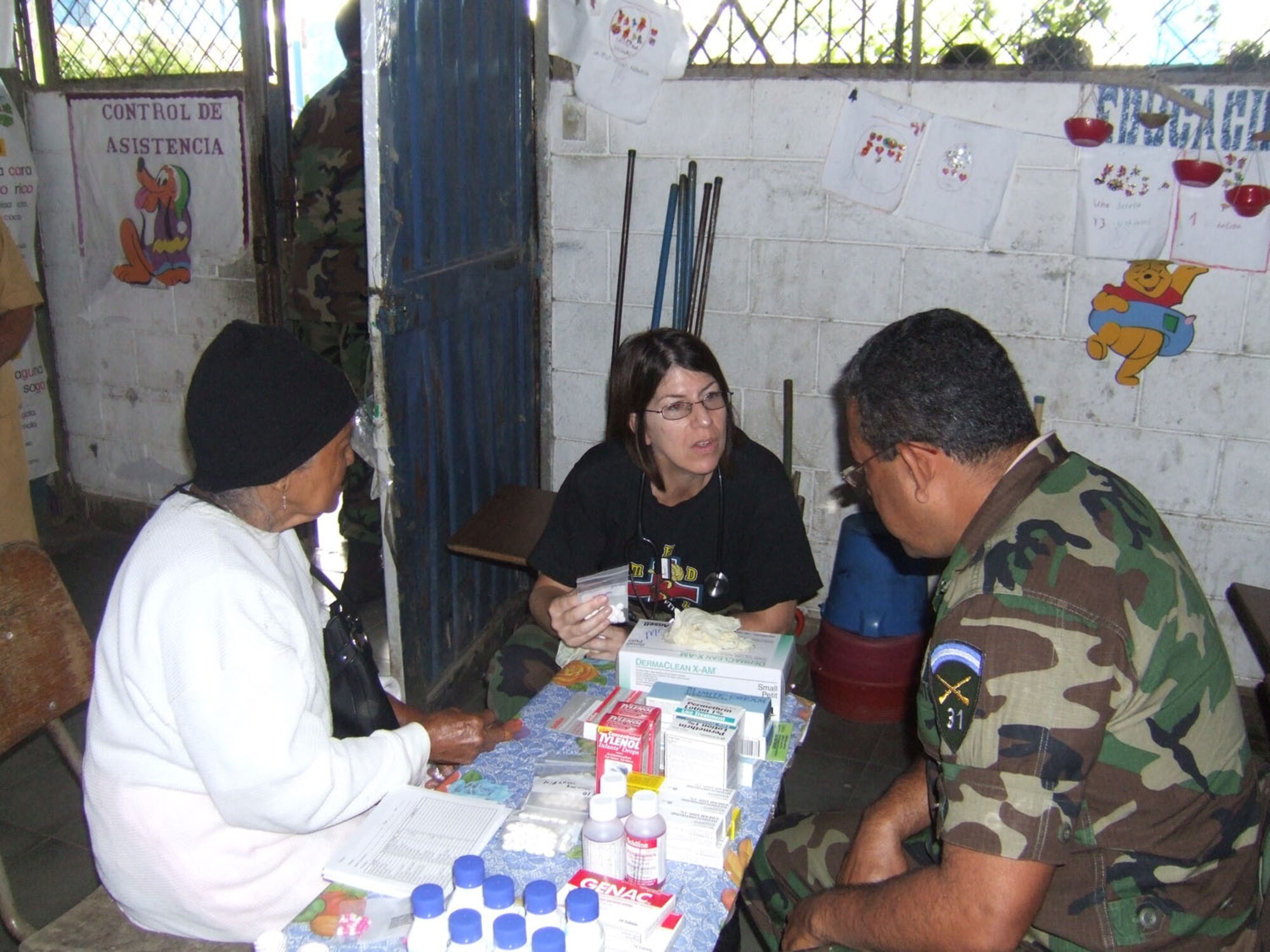 CORINTO, El Salvador - Air Force Capt. Denise Lane, a nurse with the Medical Element at Soto Cano Air Base, Honduras, talks with patients during a recent Medical Readiness Training Exercise here Nov. 5-6. (Courtesy photo)

