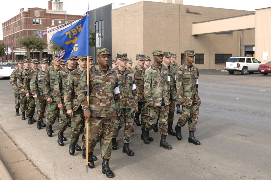 ABILENE, Texas -- Senior Airman Nathaniel Bias, 7th Aeromedical Dental Squadron, carries the 7th Medical Group guidon in the annual Abilene Veterans Day parade downtown Nov. 10. (U.S. Air Force photo by Staff Sgt. Connor Estes)