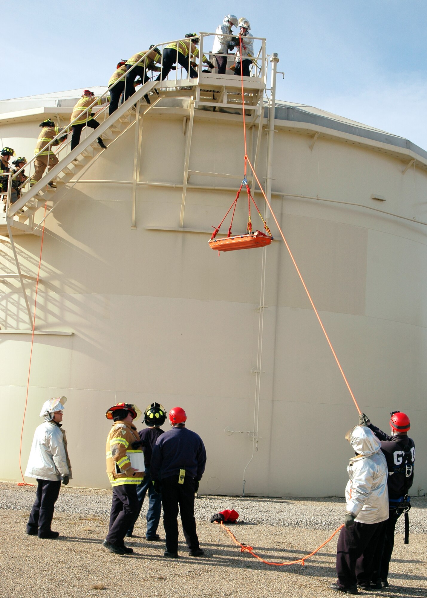GRISSOM AIR RESERVE BASE, Ind., -- Firefighters from Grissom ARB practice lowering a stretcher as part of a special exercise held recently. The exercise took place in one of the fuel tanks on base. The purpose of the exercise was to see how efficient the fire department was at rescuing a person in a confined space that may be toxic. The fire department performed well in the annual exercise. (U.S. Air Force photo/Senior Airman Carl Berry)