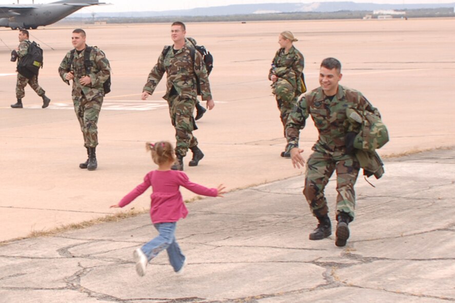 DYESS AIR FORCE BASE, Texas-- Madison Green (3) runs to greet her dad, Staff Sgt. Donald Green, from the 7th Equipment Maintenance Squadron, after his two-month deployment to Ellsworth AFB, S.D.  Sergeant Green is an aircraft structural maintenance craftsman. (U.S Air Force photo by Airman 1st Class Felicia Juenke)