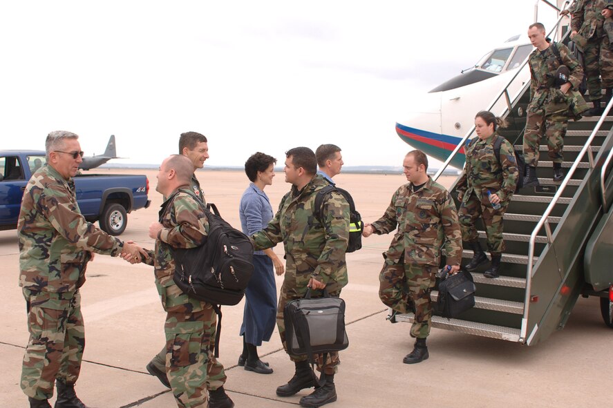 DYESS AIR FORCE BASE, Texas-- (From left to right) Col. James Hammes, Col. Gavin Ketchen, Mrs. Rhonda Ray, and Col. Timothy Ray welcome members of Dyess back to the base  Nov.  11 after their two-month deployment to Ellsworth AFB, S.D. More than 550 members were deployed along with the B-1 bombers in order to repave the runway here. (U.S. Air Force photo by Airman 1st Class Felicia Juenke)