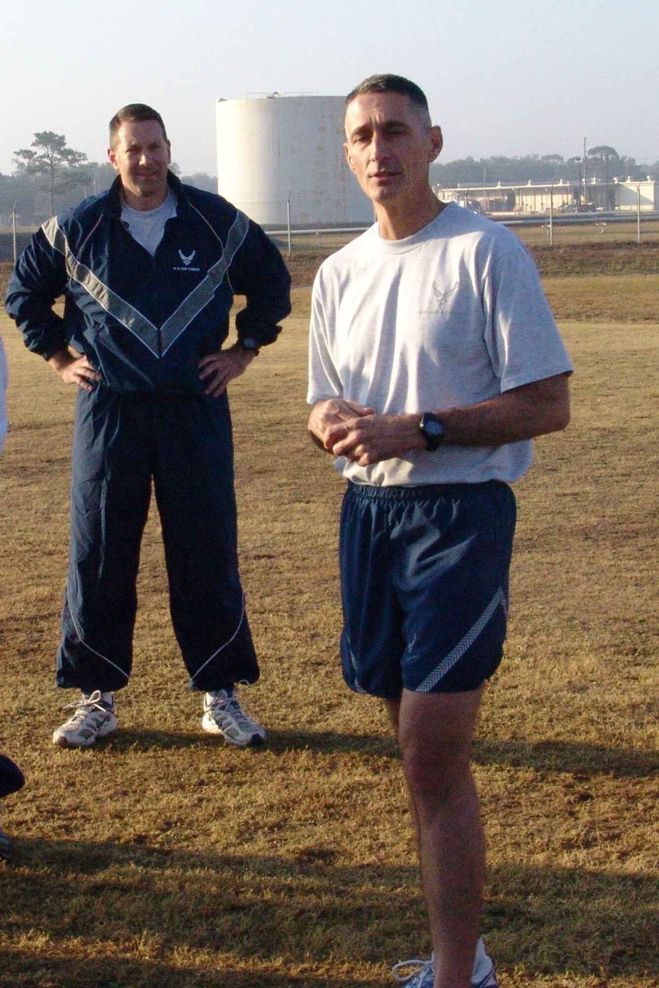 EGLIN AIR FORCE BASE, Fla. -- Chief Master Sgt.Jonathan Hake, command chief for Air Force Materiel Command, talks to 96th Communication Group personnel during their morning physical fitness training.  Chief Hake spent the day visiting troops around the base. (USAF photo by Lois Walsh)
                                
