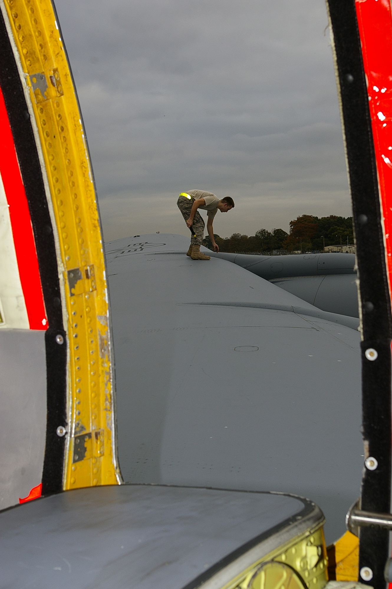 RAF Mildenhall, U.K. - Staff Sgt. Brandon Becker, 100th Aircraft Maintenance Squadron, inspects a wing on a KC-135R Stratotanker before sending it on a black-letter initial flight. Black letters, as crew chiefs call them, occur when a plane flies a mission with zero write ups. The feat occurs about once a year here. (U.S. Air Force photo by Karen Abeyasekere) 