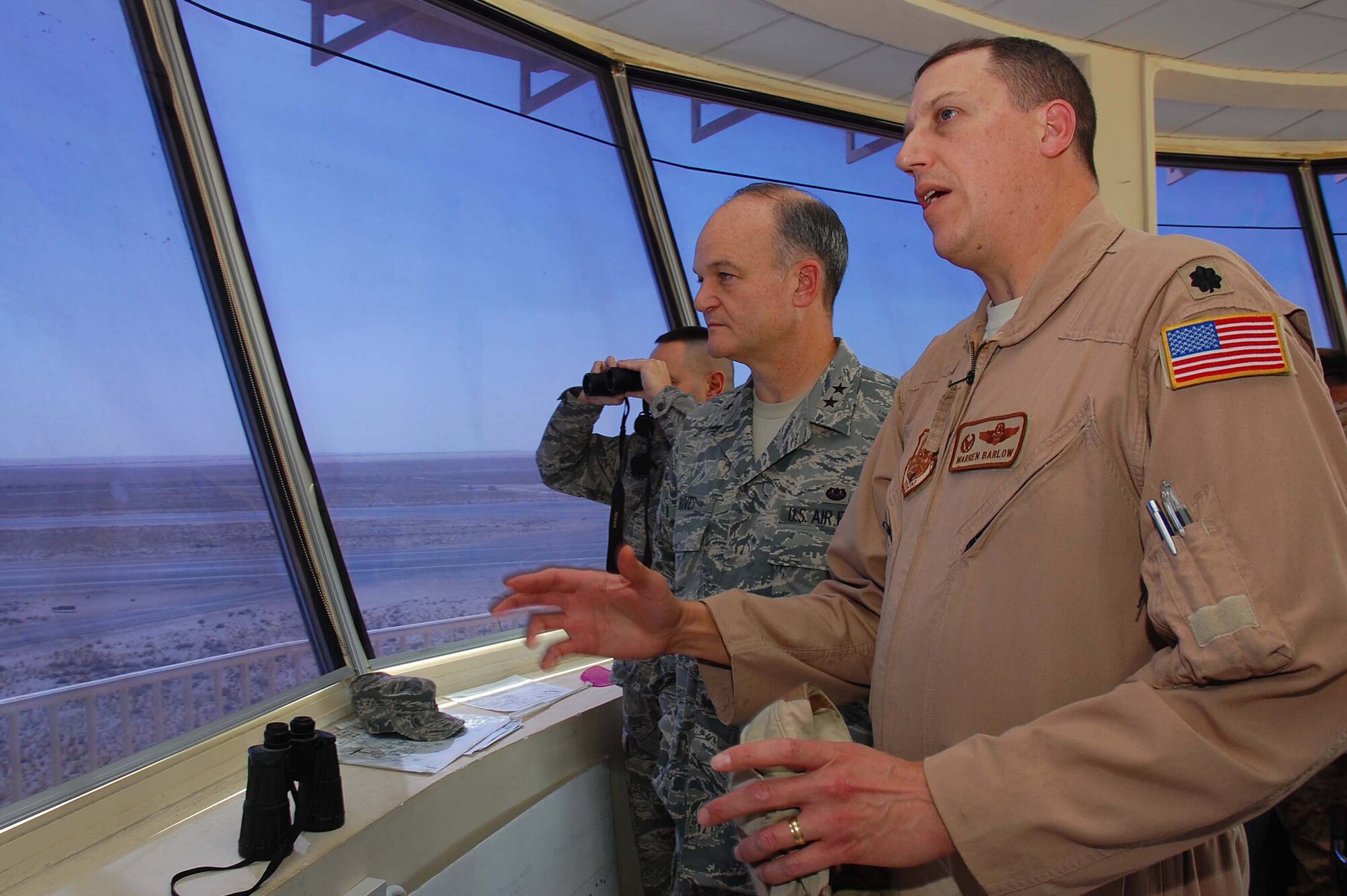 SOUTHWEST ASIA -- Maj. Gen. Jack Rives, Air Force judge advocate general, discusses airfield operations with Lt. Col. Warren Barlow, 386th Air Expeditionary Operations Support Squadron commander, at an undisclosed location in Southwest Asia Nov. 8.  General Rives' visit included reviewing the 386 AEW legal programs and meeting with deployed Airmen from units around the world.  (U.S. Air Force photo by Staff Sgt. Tia Schroeder)  