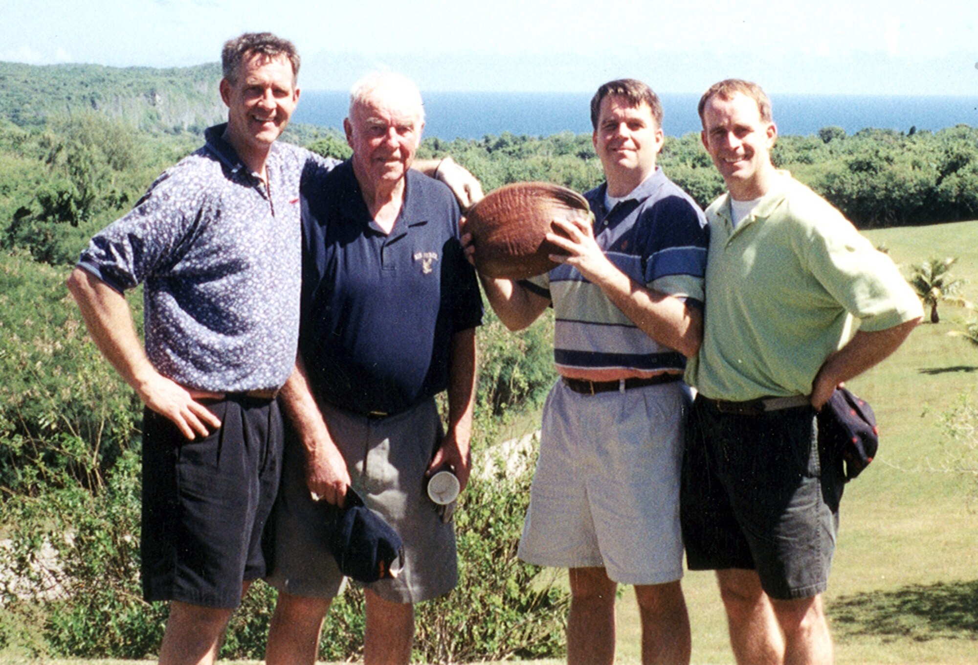The Burling sons took their dad back to Saipan in 2002. Jim Jr., Jim Sr., John and Steve stand in the spot where Jim Sr., lived in a Quonset hut during World War II, which is now in the middle of a golf course. (Courtesy photo)