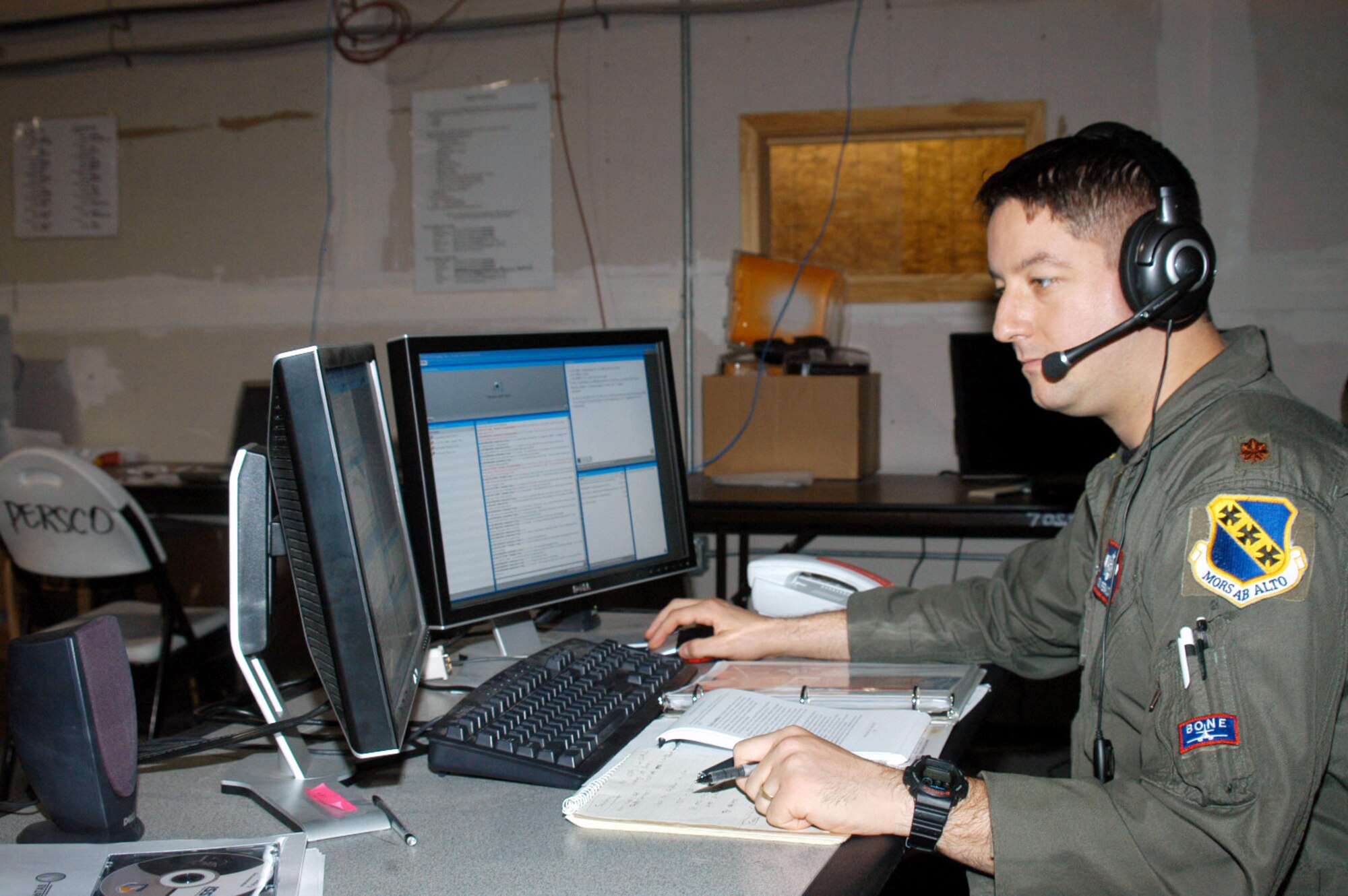 Major Tom Peralta, 7th Operations Support Squadron chief of combat plans, participates in a courses of action development briefing at the information control center at Dyess' cantonment area Nov. 13. The briefing was conducted on new software that's being experimented with here and at other bases nationwide in order to bring strategic, operational and tactical levels of leadership together. Once Dyess users provide feedback to the software producers, the final product will provide the war fighter with a communication tool that gives them better situational awareness and decreased response time during mission planning. (U.S. Air Force photo by Senior Airman Carolyn Viss)                                