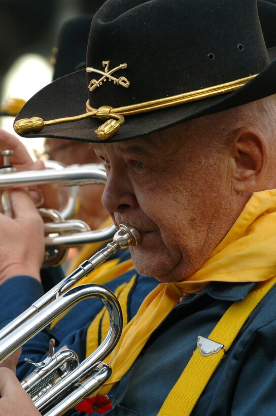 Members of the the Seventh Cavalry Drum and Bugle Corps performs in a parade in downtown Rapid City, S.D., Nov. 11, 2007.  Rapid City hosted this parade down Main Street in honor of all those who have served and are currently serving in the United States armed forces on Veterans Day.  The Seventh Cavalry Corps is based in Rapid City, S.D., and is a volunteer marching band made up of a diverse group of members that dress in authentic 19th century costume, and march in the biggest parades around the area.  (U.S. Air Force photo by SSgt Michael B. Keller)(Released)