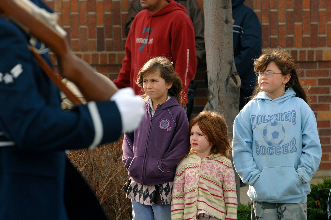 Spectators watch a passing parade in downtown Rapid City, S.D., Nov. 11, 2007.  Rapid City hosted this parade down Main Street in honor of all those who have served and are currently serving in the United States armed forces on Veterans Day.  (U.S. Air Force photo by SSgt Michael B. Keller)(Released)