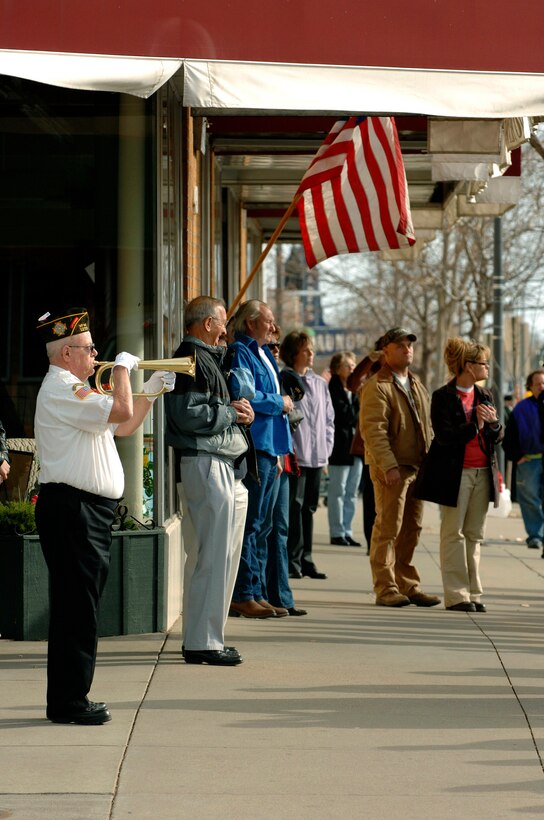 A member of the Veterans of Foreign Wars Post 1273 plays taps before the start of a parade in downtown Rapid City, S.D., Nov. 11, 2007.  Rapid City hosted this parade down Main Street in honor of all those who have served and are currently serving in the United States armed forces on Veterans Day.  (U.S. Air Force photo by SSgt Michael B. Keller)(Released)