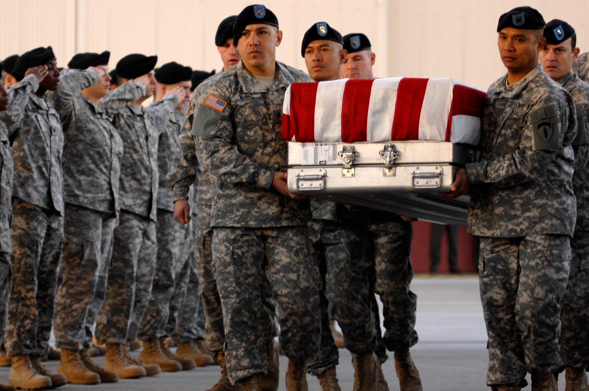 AVIANO AIR BASE, Italy--Soldiers from the 1st Battalion, 214th Aviation Regiment load a fallen Soldier onto an Air Force C-130 during a repatriation ceremony Nov. 13, for six servicemembers who were killed when a U.S. Army UH-60 Black Hawk helicopter attached to the 1st Battalion, 214th Aviation Regiment crashed Nov. 8, 22 miles southwest of Aviano, Italy.  (U.S. Air Force photo/Airman 1st Class Ashley Wood) 