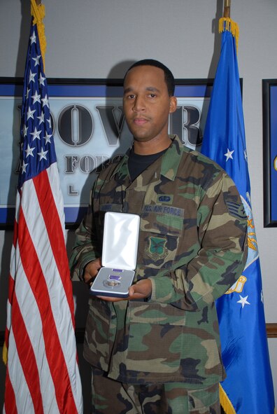 Staff Sgt. Huey Harris III displays his Purple Heart on Dover Air Force Base Nov. 9.(U.S. Air Force photo by Tech. Sgt. Kevin Wallace)