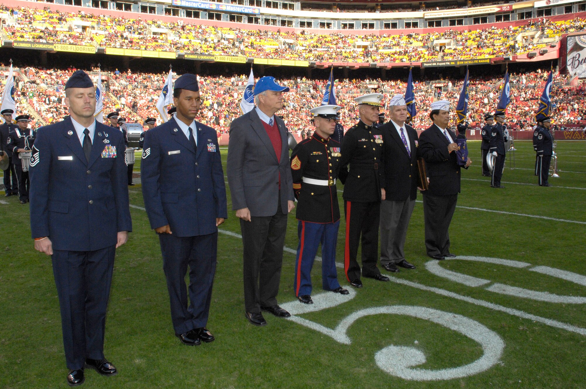 Staff Sgt. Huey Harris III (second from left), along with other Purple Heart recipients, was honored at the Washington Redskins versus Philadelphia Eagles NFL game Nov. 11 at FedEx Field in Landover, Md. (U.S. Air Force photo by Senior Airman Dan DeCook)
