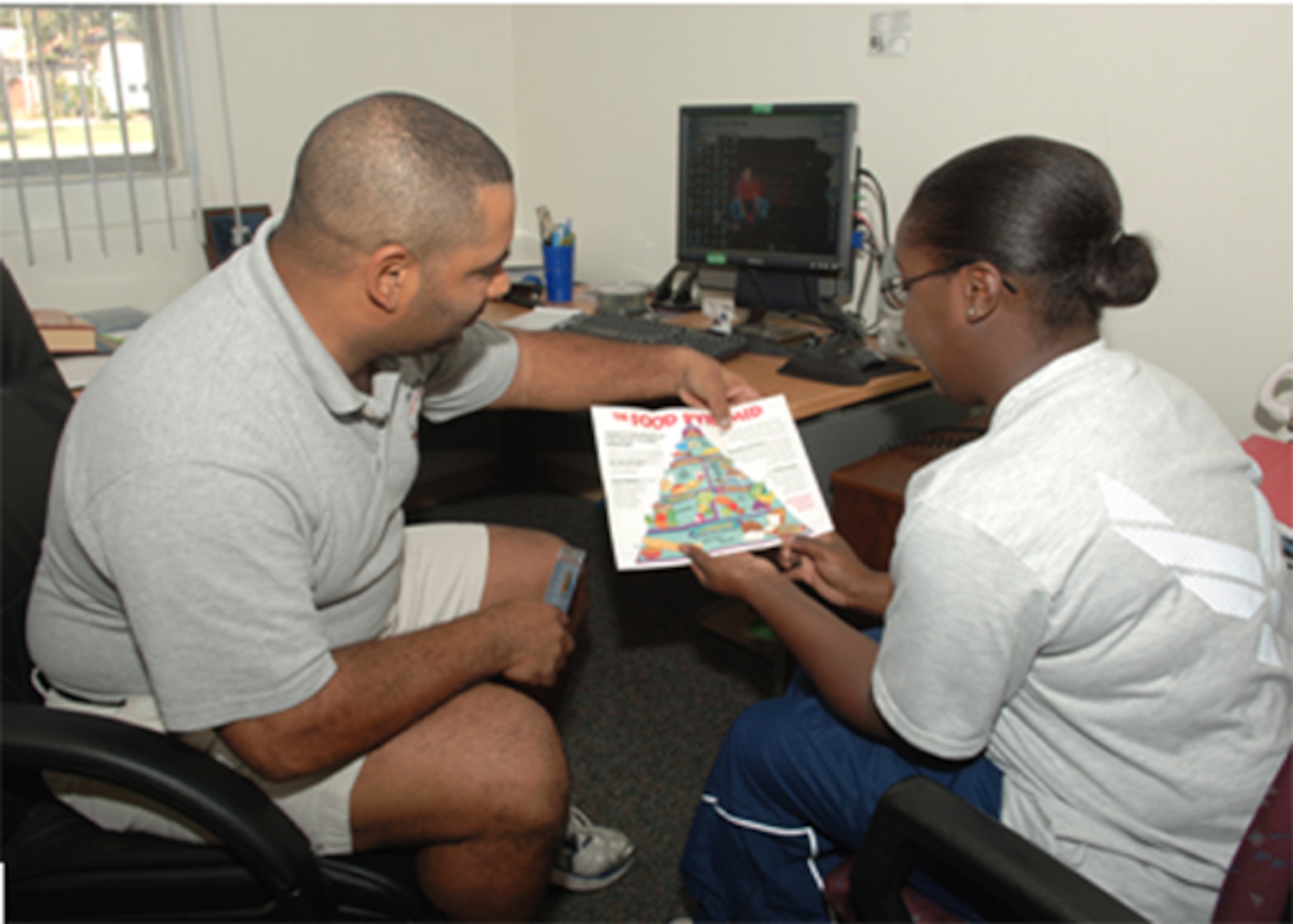 Tech Sgt. Charles McLean, 39th Medical Group Health and Wellness Center non-commissioned officer in charge, meets with Staff Sgt. Mishaki Mason, 39th MDG health service manager, to help her devise a diet plan that she can follow on a daily basis. The HAWC offers many program on different topics such as sensible weight, tobacco cessation and physical training leader classes. (U.S. Air Force photo by Senior Airman Tiffany Colburn).