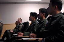 KUNSAN AIR BASE, South Korea-- Pilots from the Republic of Korea Air Force, 111th Fighter Squadron along with pilots from the 8th Fighter Wing received a mission brief here Nov. 14. ROKAF pilots and Wolf Pack pilots trained together on a joint mission to give pilots from both countries a chance to work together and hone their war-fighting skills.  (U.S. Air Force Photo/Staff Sgt. Araceli Alarcon) 
