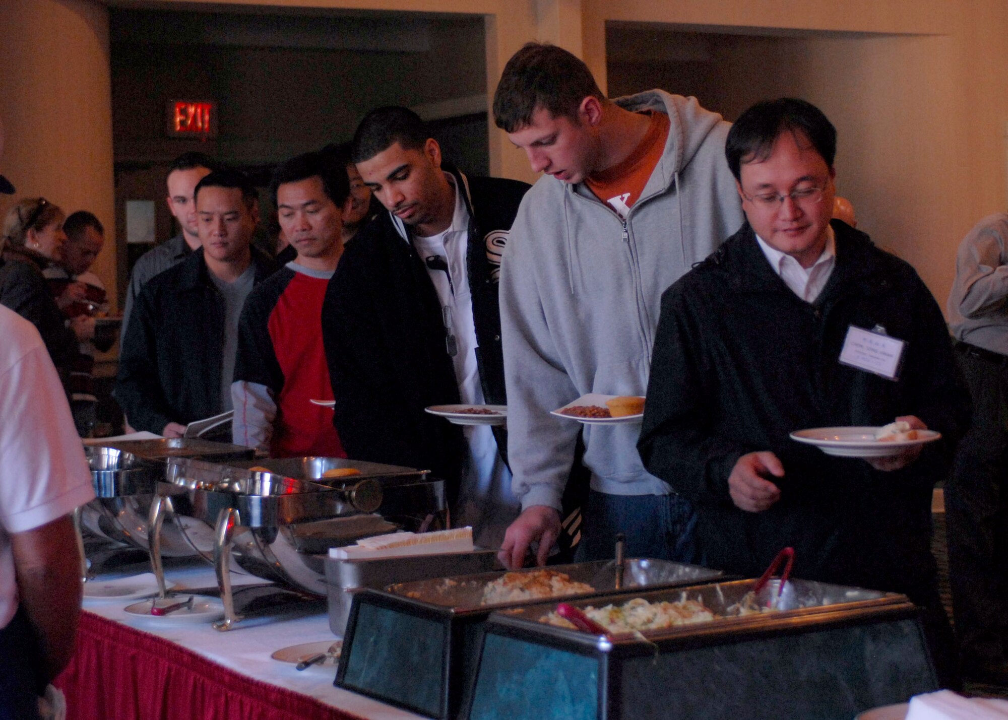 KUNSAN AIR BASE, South Korea—  Airmen from the 8th Fighter Wing enjoy a buffet provided by honorary commanders from Gunsan City, South Korea here Nov. 12. More than 60 honorary commanders held a Friendship Day for approximately 400 Wolf Pack Airmen to increase relationships between the base and local community.  (U.S. Air Force Photo/Staff Sgt. Araceli Alarcon) 