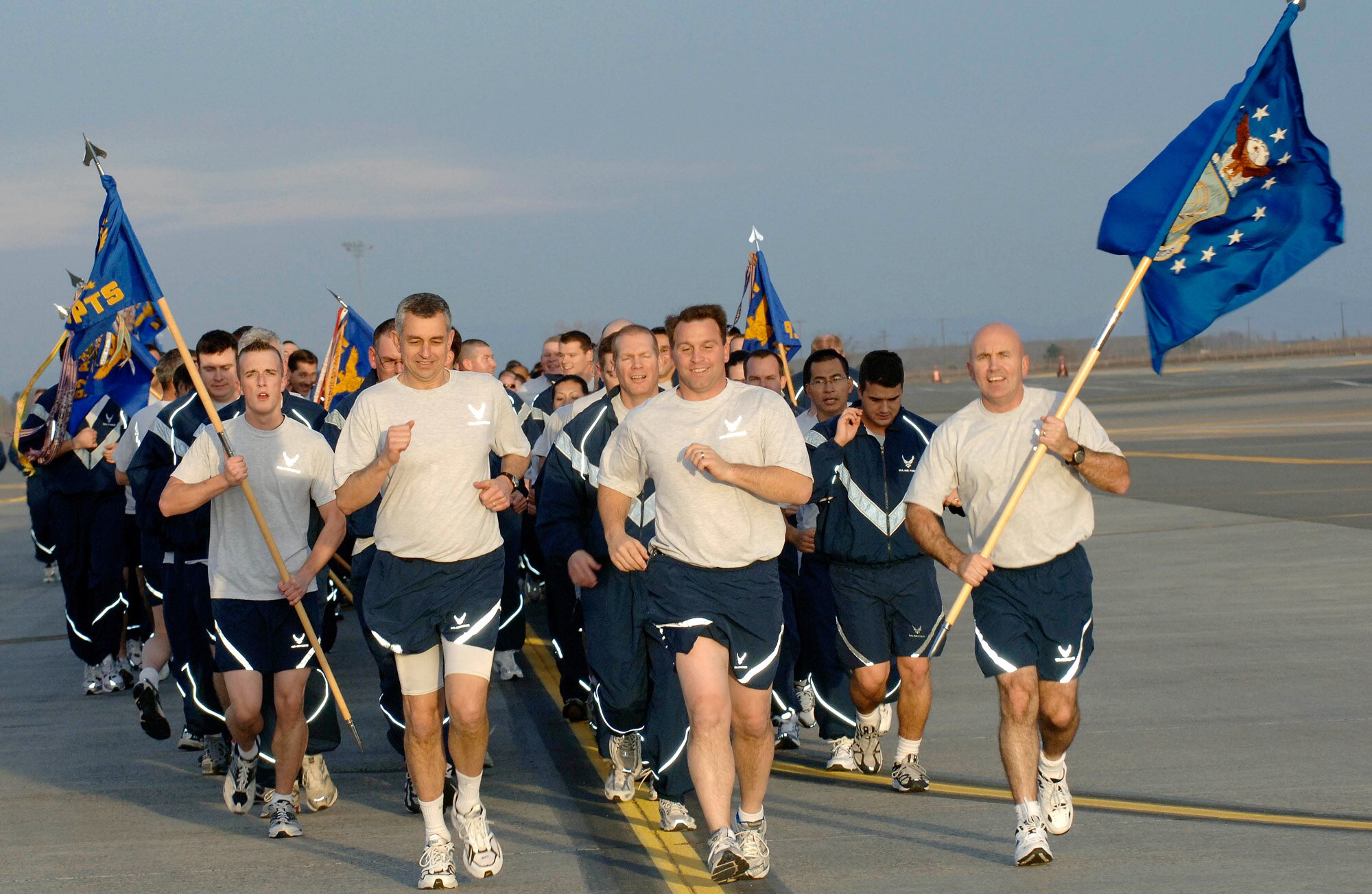 FAIRCHILD AIR FORCE BASE, Wash. – Col. Thomas J. Sharpy, 92nd Air Refueling Wing commander, Col. Roger Watkins, 92nd ARW vice commander, and Chief Master Sgt. Daniel McMullan, 92nd Operations Group superintendent, lead the troops during the Wingman Day run Nov. 9. U.S. Air Force photo / Staff Sergeant JT May III)