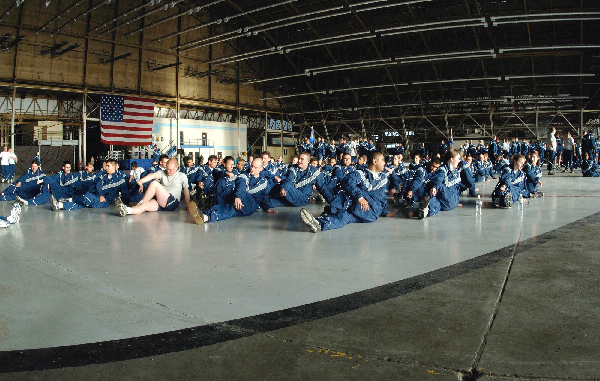 FAIRCHILD AIR FORCE BASE, Wash. – Members of Team Fairchild stretch in Hangar Two in preparation of the Wingman Day run, the culminating event during Wingman Day Nov. 9. (U.S. Air Force photo / Staff Sergeant JT May III)