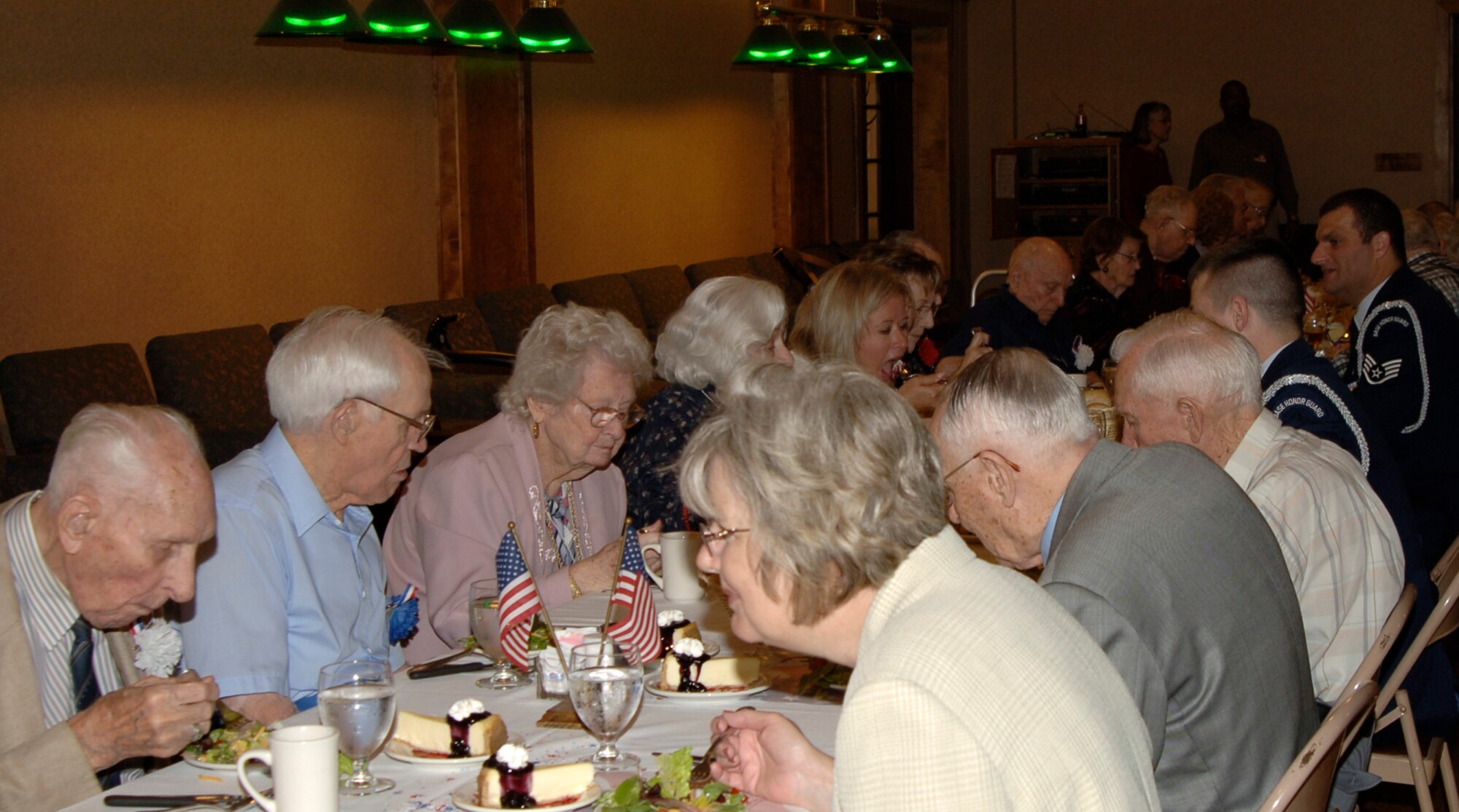 MCCONNELL AIR FORCE BASE, Kan. –- Veterans along with their loved ones dine in at the Kansas Masonic Home’s Veteran’s Day Luncheon held Nov 12. As the Veterans share a meal with their loved ones they tell stories about the wars they have witnessed and the effects they’ve had on their lives. The Kansas Air National Guard Honor Guard also shares their experiences as they dine with the Veterans. (Photo by Airman 1st Class Laura Suttles)