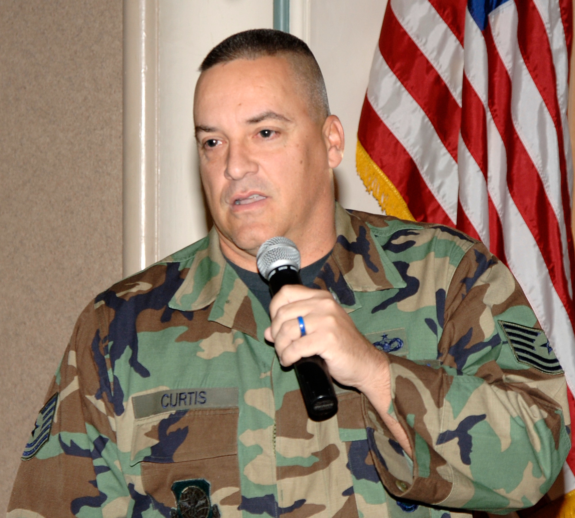 MCCONNELL AIR FORCE BASE, Kan. –- Tech. Sgt. Brian Curtis, 22 Security Forces Squadron, speaks to veterans and their loved ones at the Kansas Masonic Home Nov. 12. Sergeant Curtis, guest speaker for the Kansas Masonic Home’s Veterans Day Luncheon, describes in detail the differences and similarities between the wars America has faced ranging from World War I to Operation Iraqi Freedom. He shares with them stories of today’s war and the people it is affecting and how the military is helping the civilians of other nations. (Photo by Airman 1st Class Laura Suttles)