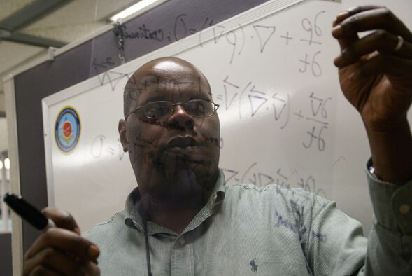 Dr. Terrance Dubreus examines a math modeling and computer simulation equation for an upcoming test in one of AEDC’s wind tunnels. (Photo by Philip Lorenz III)