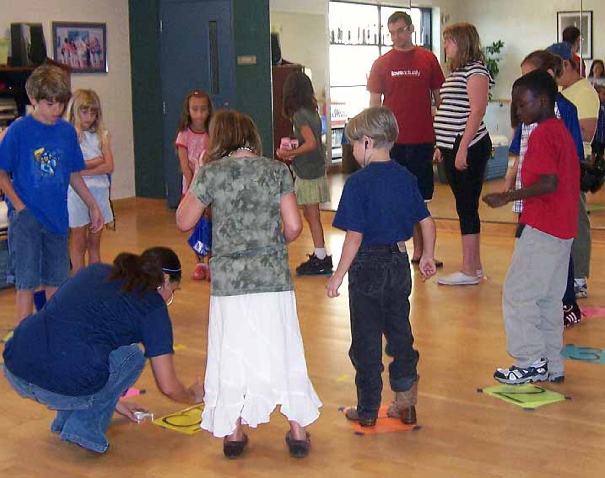 Samantha Burk draws a number on a piece of paper as the kids prepare for a health walk. Prizes for the health walk consisted of juices, fruit and 100 calorie food snacks. (Courtesy photo)