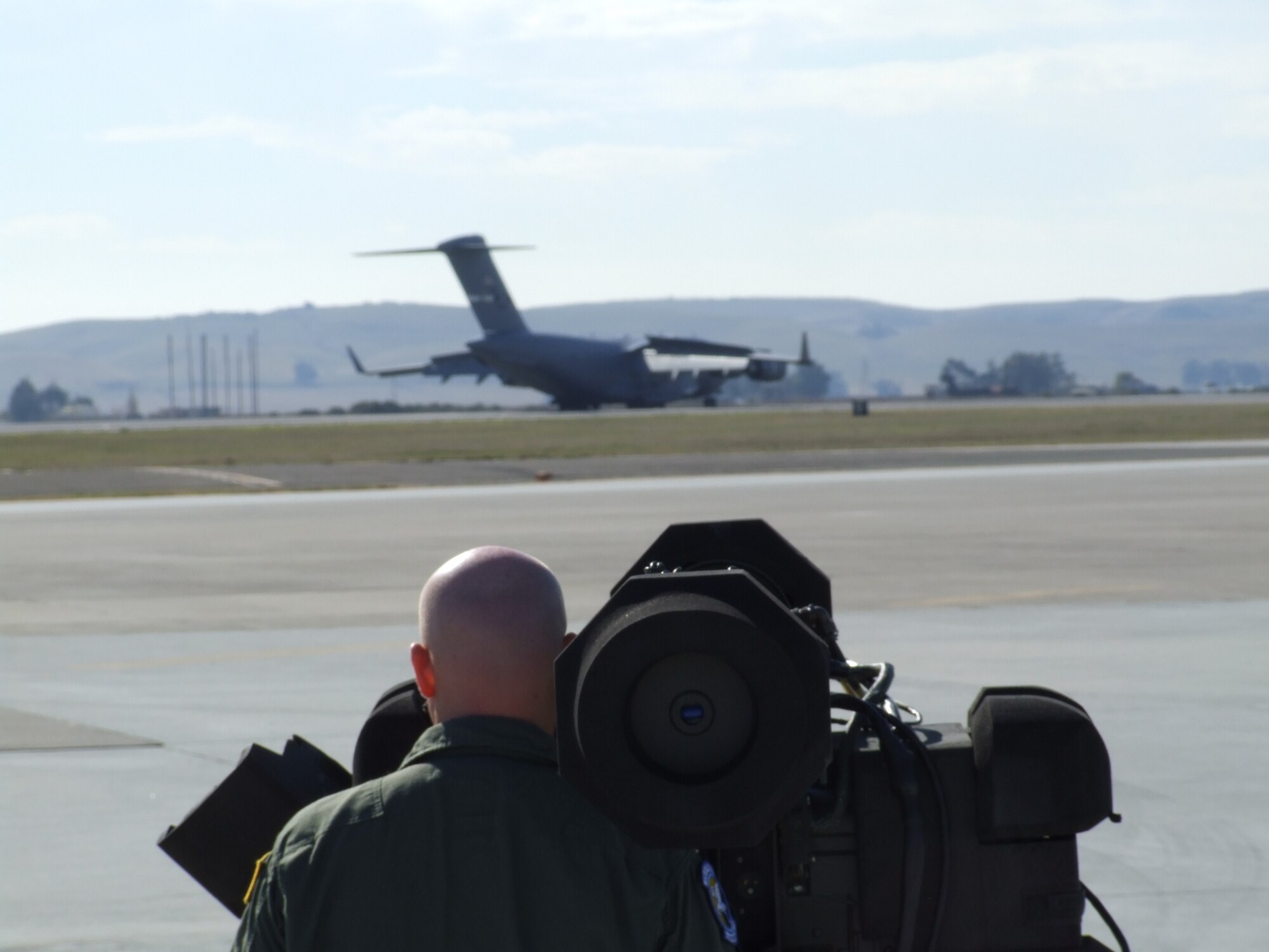 A Travis member simulates using a Man Portable Air Defense Systems on the flighline recently. The training is designed to provide the aircrews and intelligence personnel an understanding of the threats in accomplishing their mission. More than 200 Travis personnel got a chance to operate the MANPADS with aircraft taking off, landing and in flight. (U.S. Air Force photo)