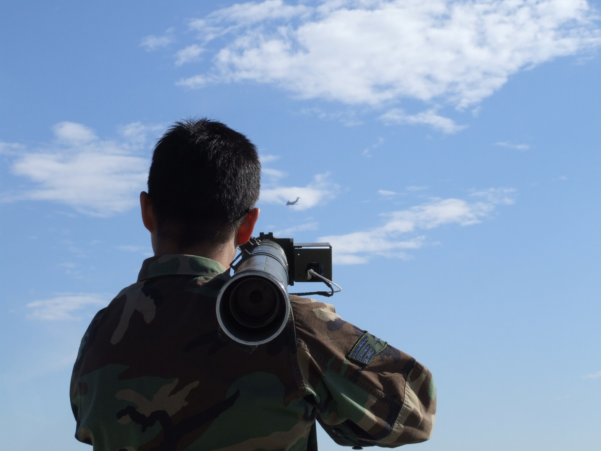 A Travis Airman practices using a simulated Man Portable Air Defense Systems on the flighline recently. The training is designed to provide aircrews and intelligence personnel an understanding of the threats in accomplishing their mission overseas. (U.S. Air Force photo)