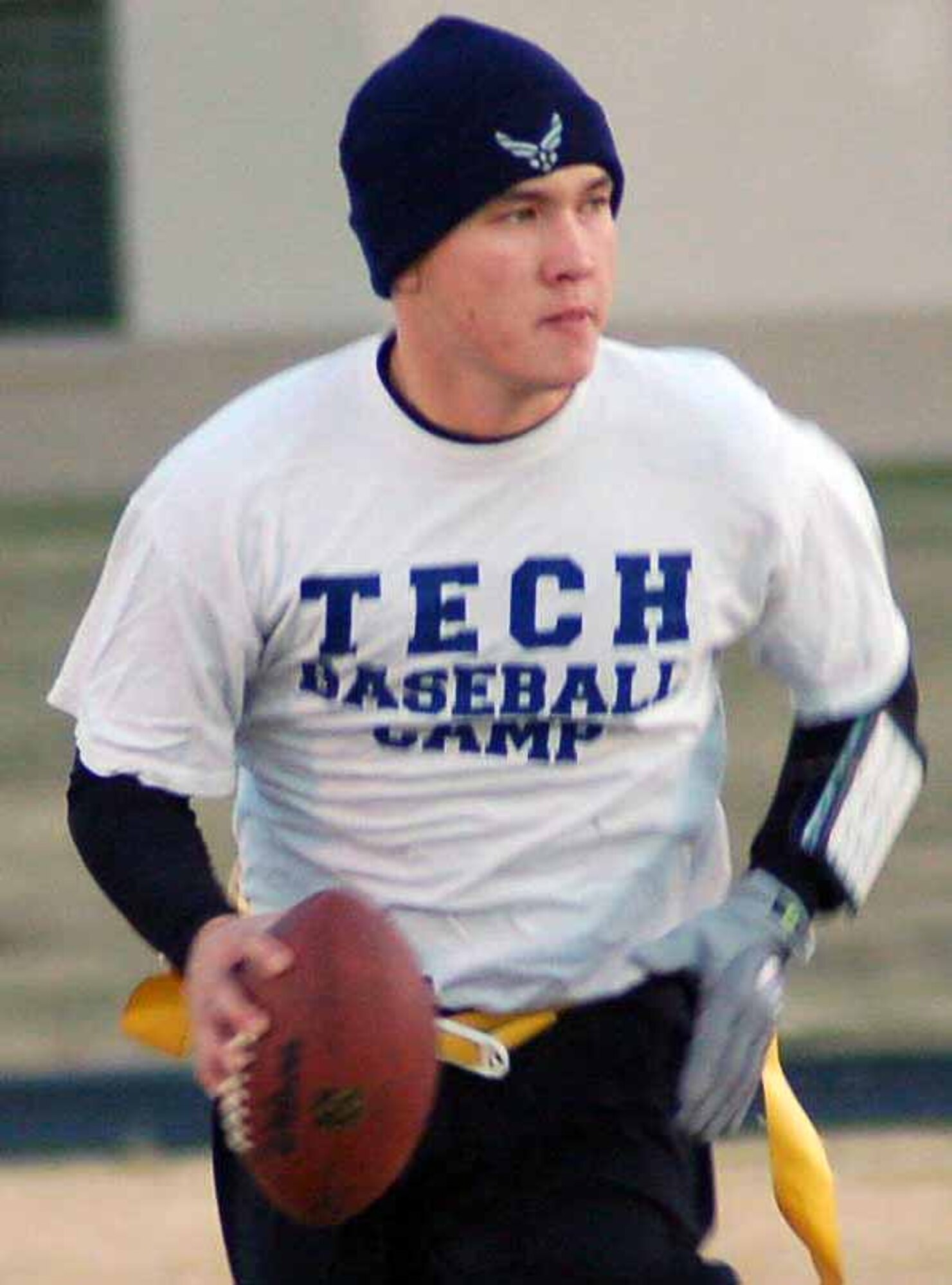 964th Airborne Air Control Squadron quarterback Christopher Brooks scrambles out of the pocket during first quarter action in a flag football playoff game against the 72nd Mission Support Squadron Nov. 6 at the Tinker Sports Complex. The 72nd MSS won the game 14-10. (Air Force photo by John E. Banks)