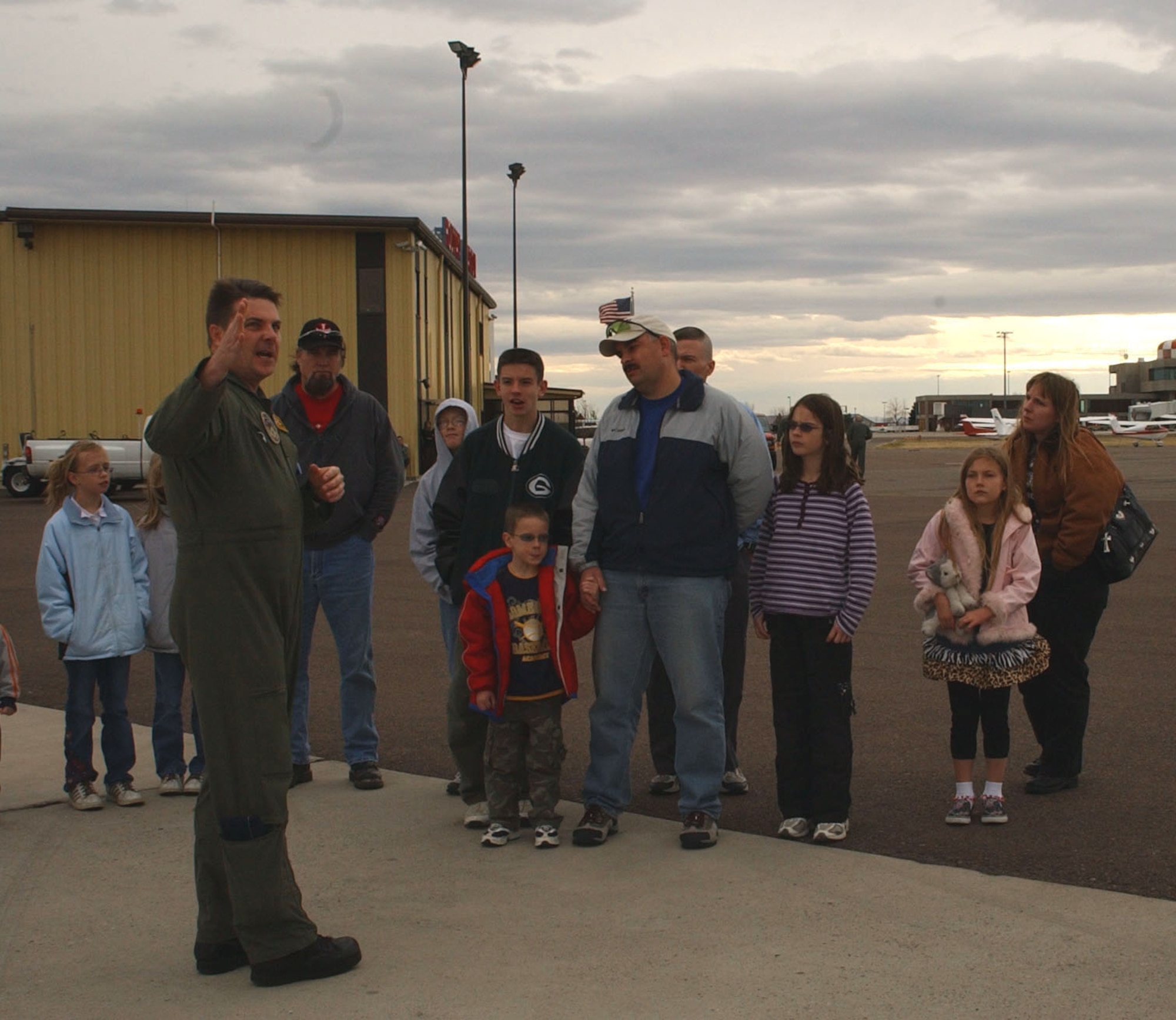 Lt. Col. Lance Ribordy, Airborne Command Post crew member, briefs a group prior to touring the aircraft. The ABNCP crew visited Malmstrom Nov. 9 to 11 and gave tours of the aircraft at Holman Aviation at the Great Falls International Airport Nov. 10. (U.S. Air Force photo/Airman 1st Class Emerald Ralston)