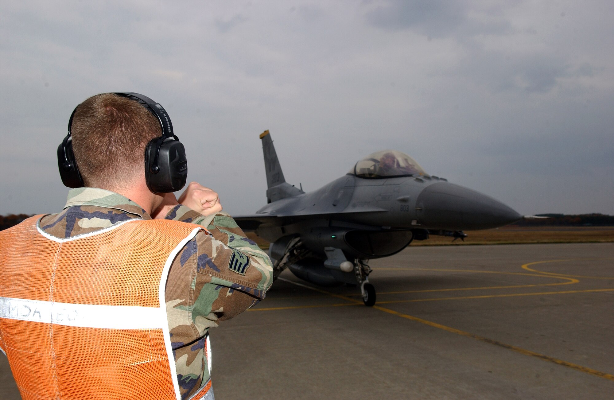 Staff Sgt. John Swearingen marshalls Capt. Jonathan Wentzel in his F-16 Fighting Falcon for a final inspection prior to take off during exercise Keen Sword Nov. 14 at Misawa Air Base, Japan. Sergeant Swearingen is with the 35th Aircraft Maintenance Squadron and Captain Wentzel is with the 35th Operations Support Squadron. (U.S. Air Force photo/Senior Airman Robert Barnett) 