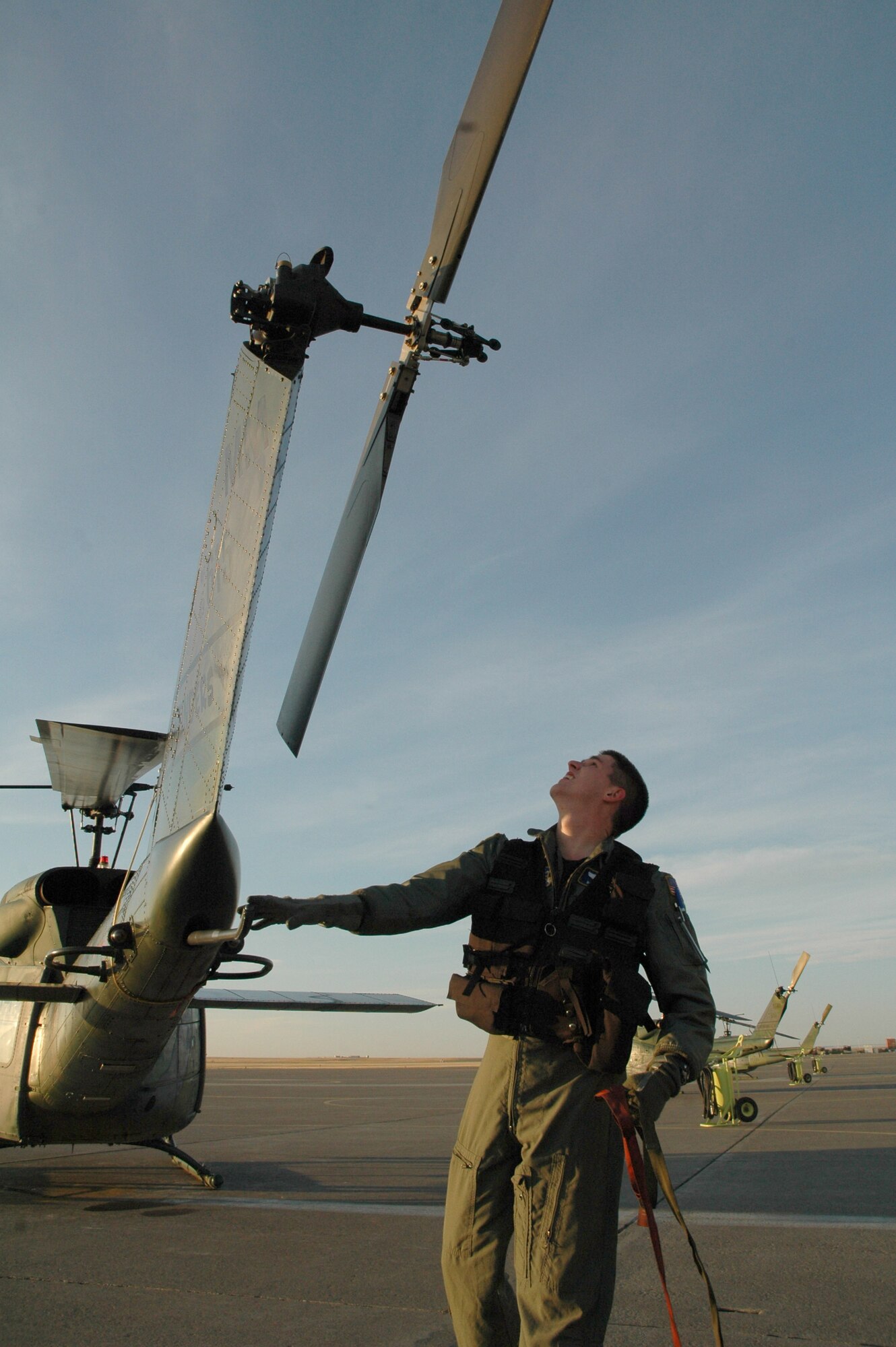 Capt. Ben Brown, 40th Helicopter Squadron pilot, performs routine pre-flight inspections on a UH-1N Huey helicopter at Malmstrom Air Force Base, Mont., Oct. 31. The UH-1N is a light-lift utility helicopter used to support Air Force Space Command missile wings and groups. (U.S. Air Force photo/Senior Airman Eydie Sakura)