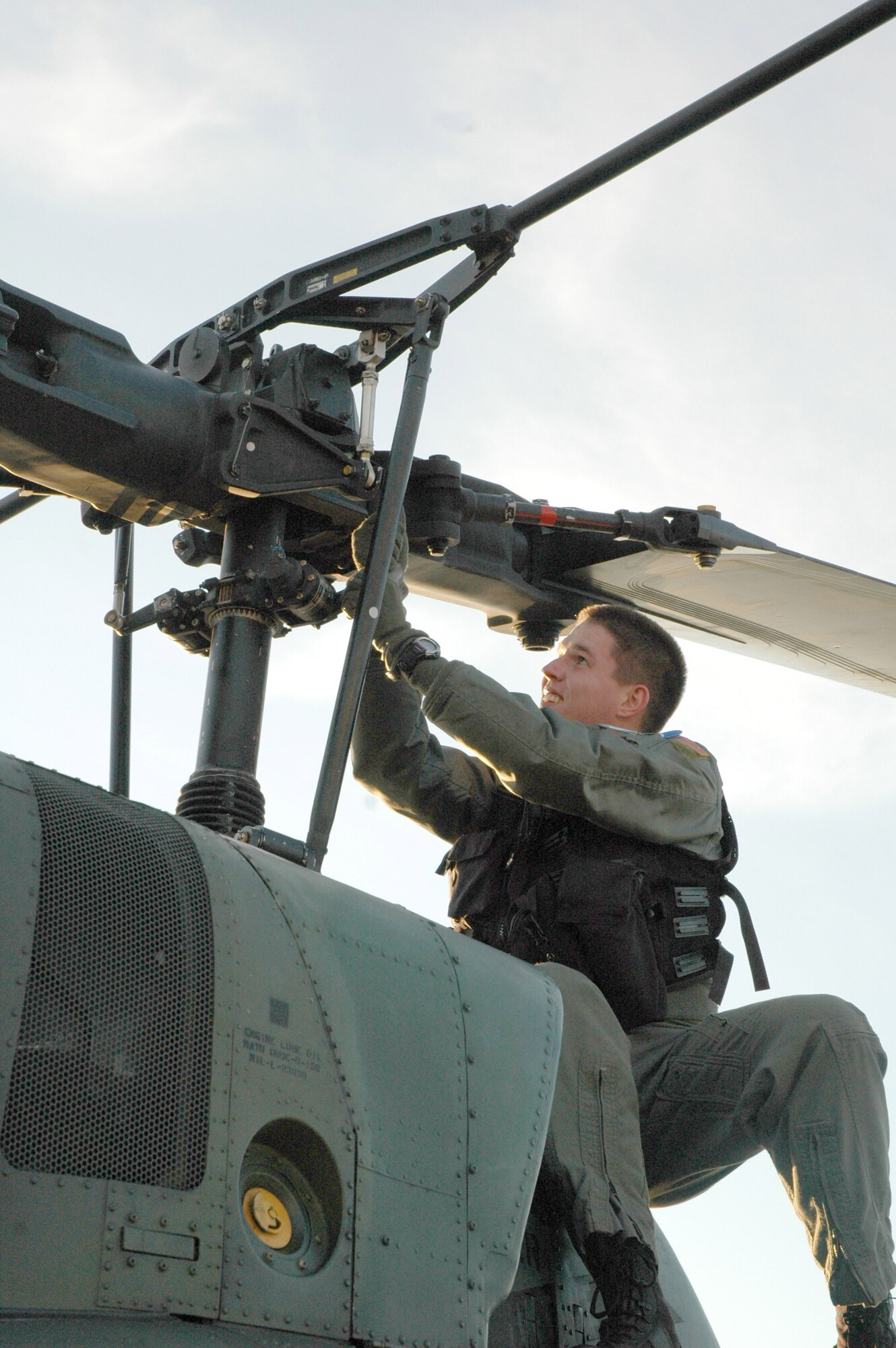 Capt. Ben Brown, 40th Helicopter Squadron pilot, performs routine pre-flight inspections on a UH-1N Huey helicopter at Malmstrom Air Force Base, Mont., Oct. 31. The UH-1N is a light-lift utility helicopter used to support Air Force Space Command missile wings and groups. (U.S. Air Force photo/Senior Airman Eydie Sakura)