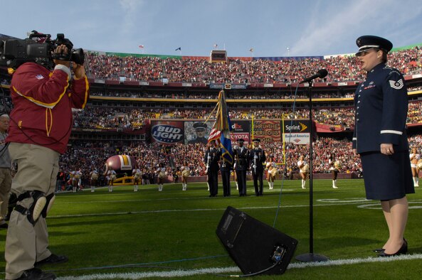 BOLLING AFB, D.C. – Tech. Sgt. Paige C. Martin, a vocalist with the U.S. Air Force Band’s Airmen of Note here, sings the national anthem prior to the start of a Washington Redskins home game against the Philadelphia Eagles Nov. 11.  (U.S. Air Force photo by Senior Airman Daniel R. DeCook)