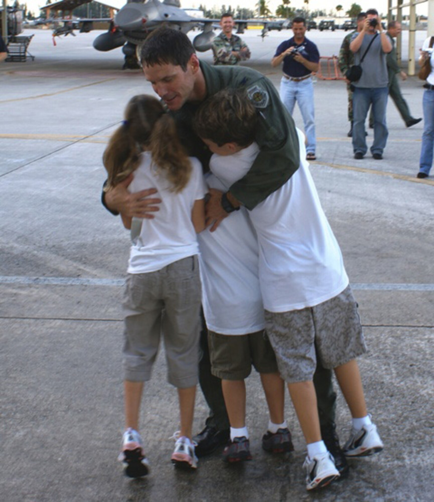 Col. Robert Polumbo, 482nd Fighter Wing vice commander, is greeted after surpassing 4,000 F-16 flying hours on Tuesday. While many fighter pilots have completed 4,000 flying hours, only a handful of fighter pilots around the world have surpassed that many in one airframe.  (U.S. Air Force photo/Tim Norton)