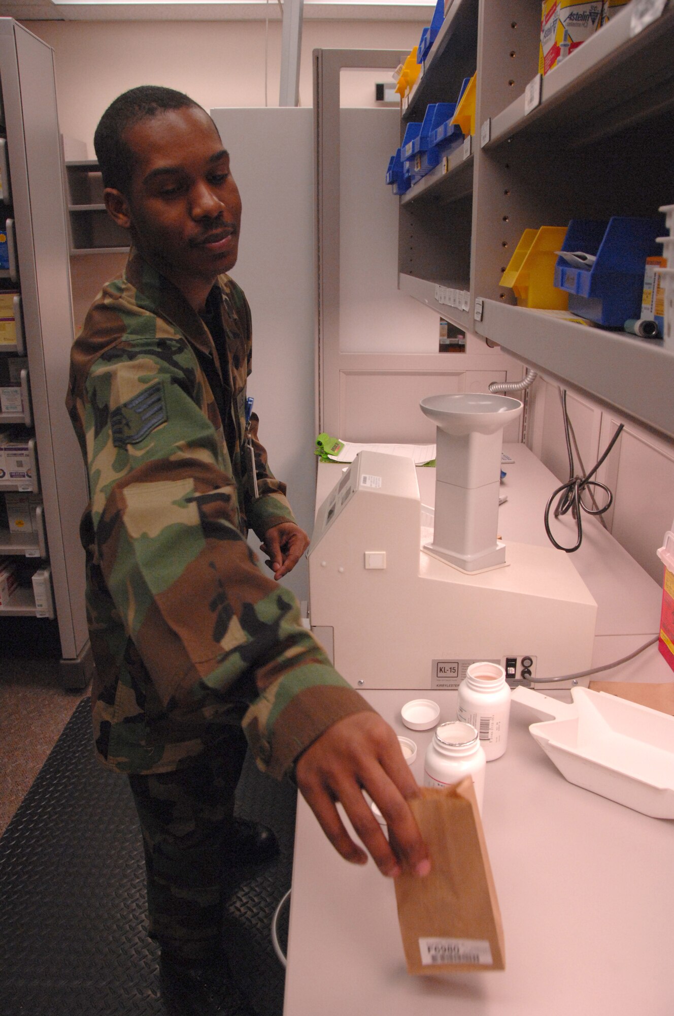 EIELSON AIR FORCE BASE, Alaska -- Staff Sgt. Julius King, 354th Medical Support Squadron pharmacy technician, bags prescribed medication for a patient Nov. 14, 2007 at the medical clinic. The 354th Medical Group provides outpatient managed healthcare for all active-duty military members and TRICARE eligible beneficiaries living in the Eielson area. (U.S. Air Force photo by Airman 1st Class Christopher Griffin)