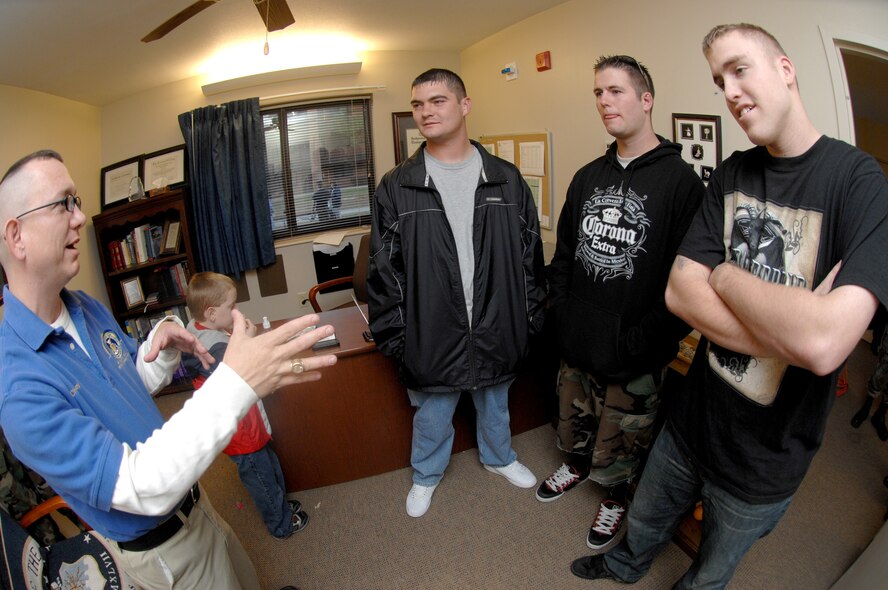 SEYMOUR JOHNSON AIR FORCE BASE, N.C. - Chaplain (Capt.) Kevin Humphrey, 4th Fighter Wing chaplain, shows Airmen 1st Class Eric Wells and Jake Trowbridge, 335th Fighter Squadron, and Airman 1st Class John James, 4th Component Maintenance Squadron, his new office in the dorms during the grand opening November 8. Chaplain Humphrey discusses that moving to the dorms makes it easier to support the young troops on base. (U.S. Air Force photo by Airman 1st Class Salma Din)(Released)