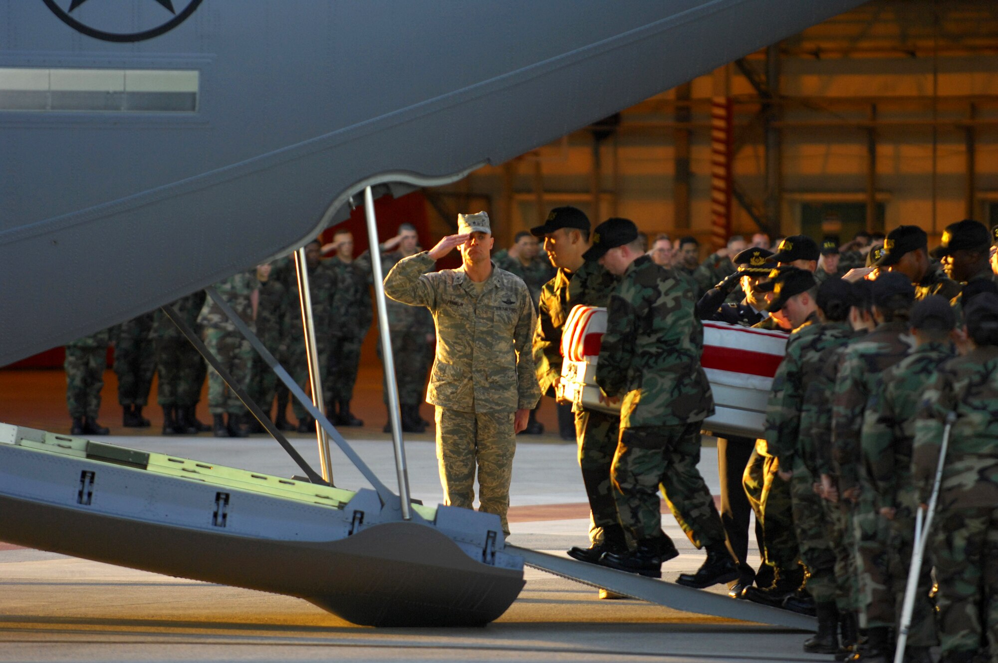Brig. Gen. Craig A. Franklin salutes as a fallen Airman is carried onto a C-130 Hercules to be transported back to the United States Nov. 13 at Aviano Air Base, Italy. Airmen and Soldiers from Aviano AB attended the repatriation ceremony for six servicemembers who were killed when an Army UH-60 Black Hawk helicopter attached to the 1st Battalion, 214th Aviation Regiment crashed Nov. 8, 22 miles southwest of Aviano, Italy. General Franklin is the 31st Fighter Wing commander. (U.S. Air Force photo/Staff Sgt. Michael R. Holzworth) 
