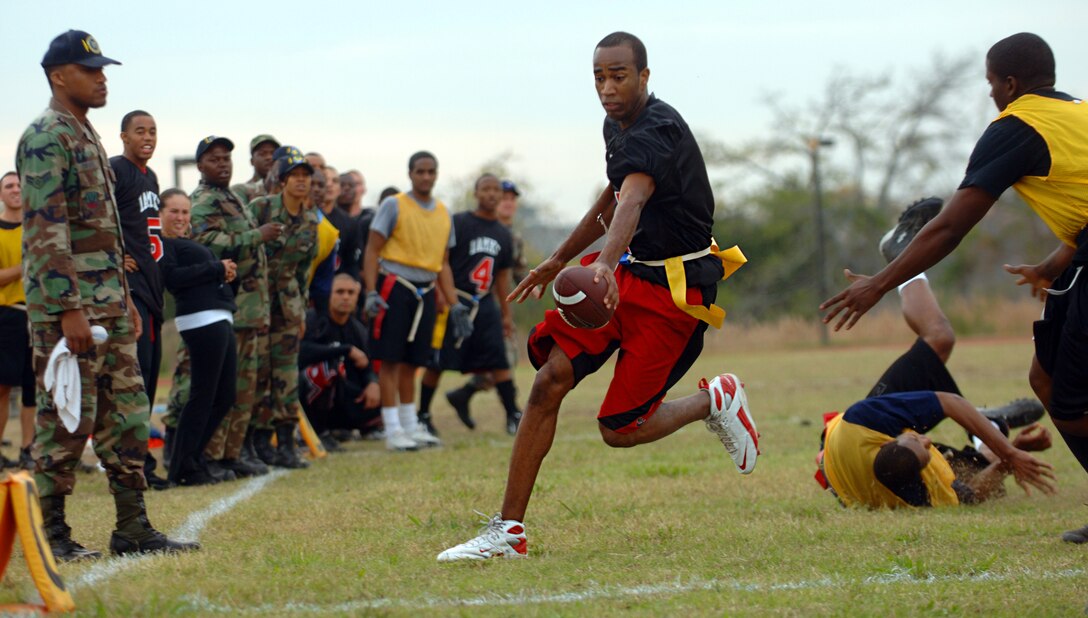 Nate Burch stretches the football over the goal line during the Flag Football Championship Game against the 1st Communications Squadron on Nov. 13.  Burch led the 1st Aircraft Maintenance Squadron with 2 touchdowns, but it wasn't enough for the victory.  Communications won 19-13 with a last minute touchdown. (U.S Air Force photo/Airman 1st Class Vernon Young)