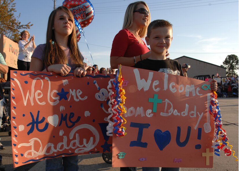 MOODY AIR FORCE BASE, Ga. -- Children await the arrival of their father, who is a member of the 822nd Security Forces Squadron here.  Approximately 175 Airmen from the 822nd SFS returned here Nov. 14 from a six-month deployment to Camp Bucca, Iraq. The 822nd SFS members were greeted by family, friends and fellow co-workers upon their return. (U.S. Air Force photo by Airman First Class Brittany Barker)