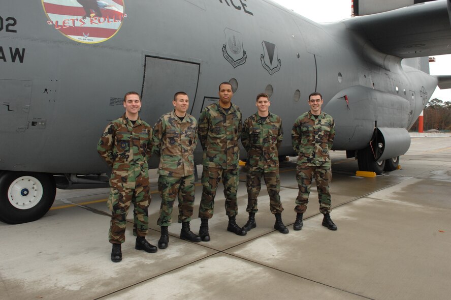 (left) Senior Airman Jonathan Wander, dedicated crew chief, Airman 1st Class Jeffery Marino, electronic and environmental systems specialist, Senior Airman Phillip McClairen, DCC, Staff Sgt. Joel Pomerene, DCC, and Staff Sgt. James Chambless, DCC, stand in front of a C-130E Hercules aircraft at Ramstein Nov. 9. These Airmen are all in the 86th Aircraft Maintenance Squadron. Photo by Airman 1st Class Amber Bressler