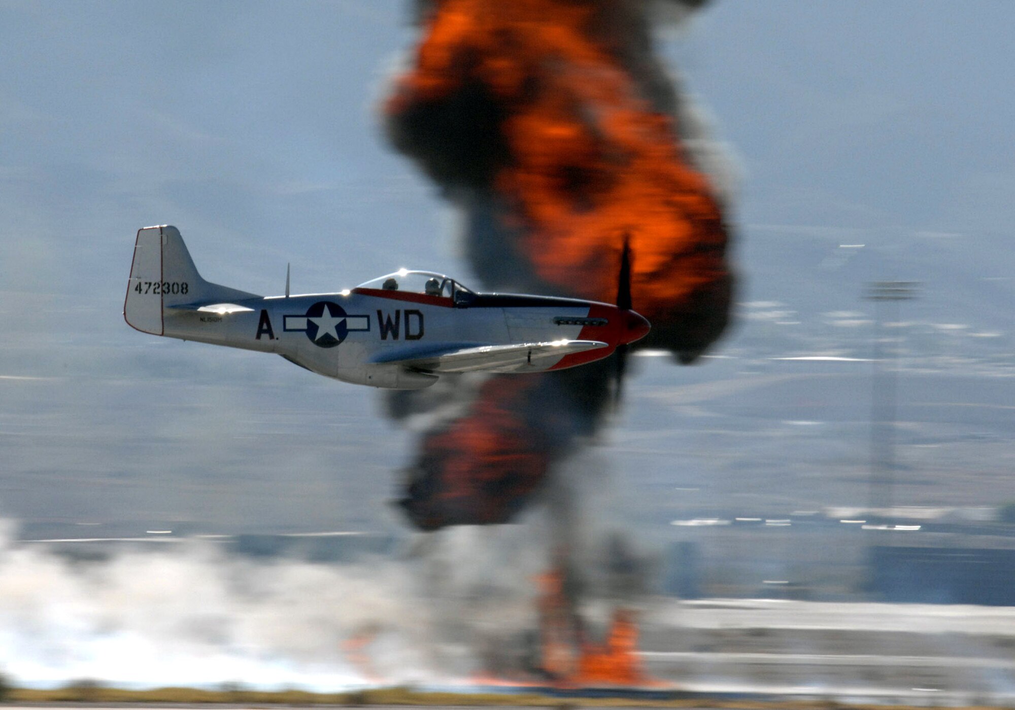 A P-51 Mustang performs for the crowd during the Aviation Nation Air Show Nov. 10 at Nellis Air Force Base, Nev. Aviation Nation is and one of the largest air shows in North America. This year's show commemorated 60 years of airpower and was the capstone event of the Air Force's yearlong 60th anniversary celebration. (U.S. Air Force photo/Staff Sgt. Jeremy Smith) 
