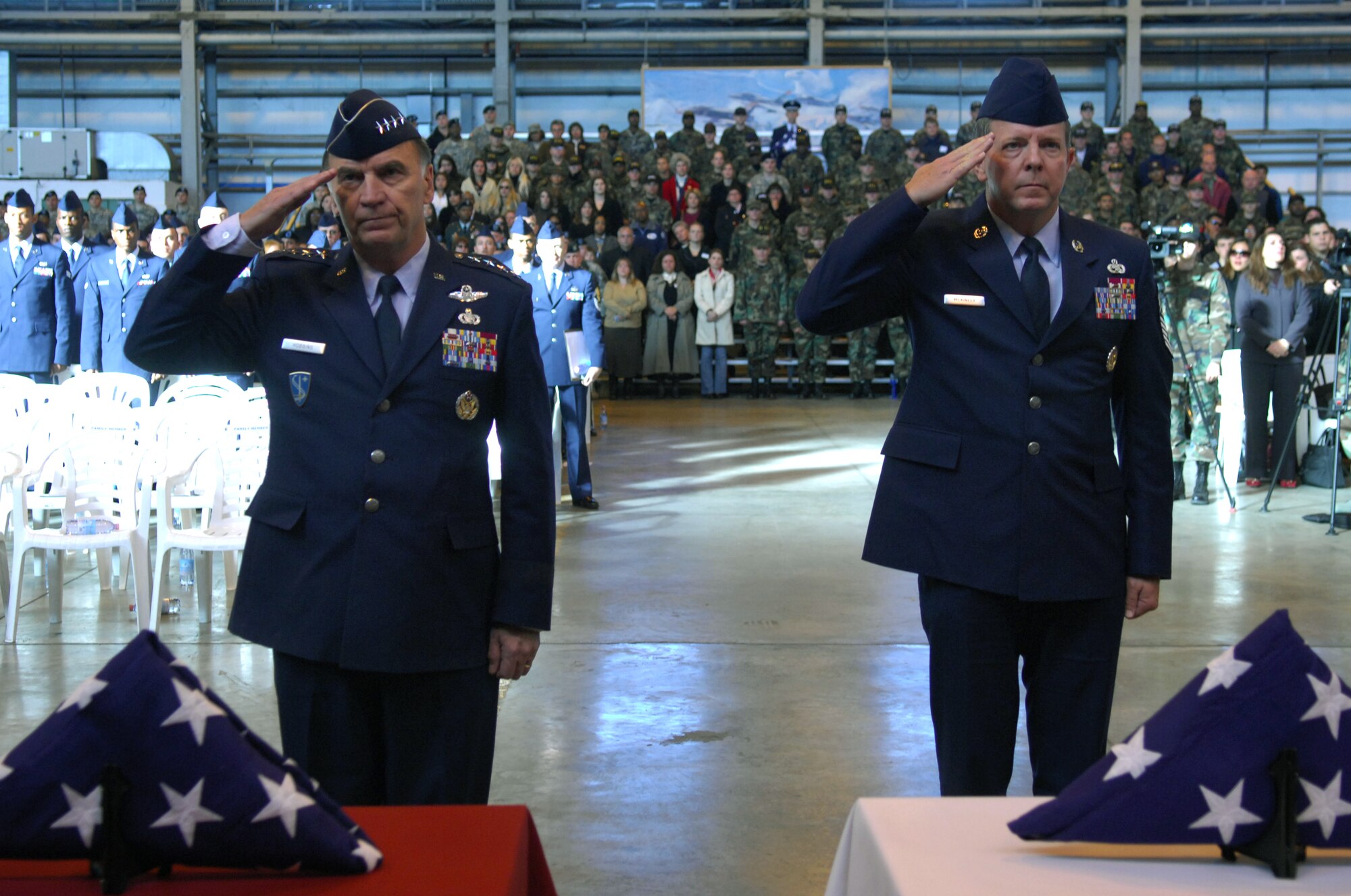 AVIANO AIR BASE, Italy-- Gen. Tom Hobbins, U.S. Air Forces Europe commander and Chief Master Sgt. of the Air Force Rodney J. McKinley issue a final salute during a memorial ceremony held Nov. 15 in honor of the six servicemembers who were killed when a U.S. Army UH-60 Black Hawk helicopter attached to the 1st Battalion, 214th Aviation Regiment crashed Nov. 8, 22 miles southwest of Aviano, Italy.  (U.S. Air Force photo/Staff Sgt. Michael R. Holzworth) 