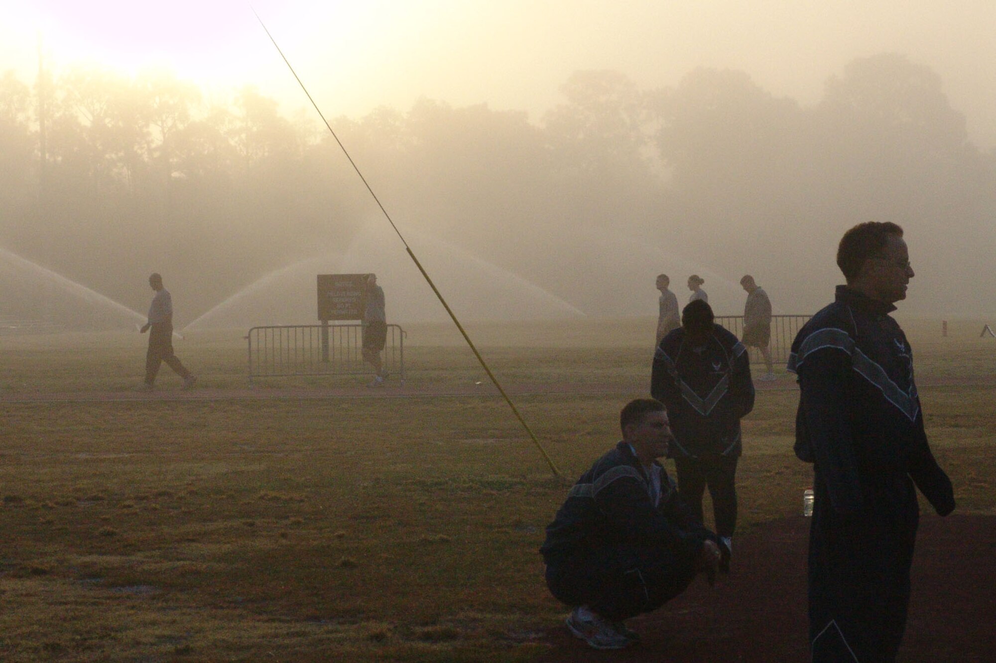 EGLIN AIR FORCE BASE, Fla. -- Personnel from the 96th Communications Group wait to begin physical training on a foggy morning in Florida. (USAF photo by Lois Walsh)