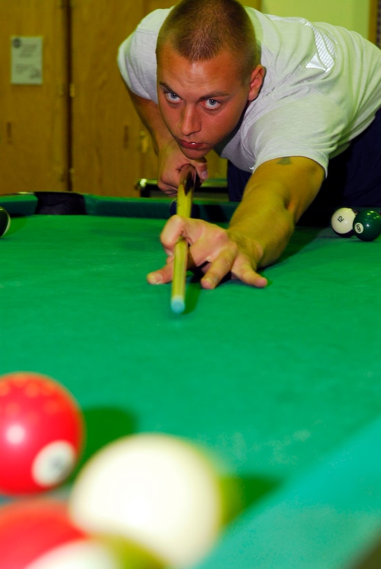 BALAD AIR BASE, Iraq -- Senior Airman Joseph Munis, a 332nd Expeditionary Maintenance Squadron, plays pool at theAir Force recreation center here, Nov. 14. The center offers a variety of games and events base personnel are able to participate in while deployed. Airman Munis is deployed from Hill Air Force Base, Utah. (U.S. Air Force photo/Staff Sgt. Joshua Garcia)