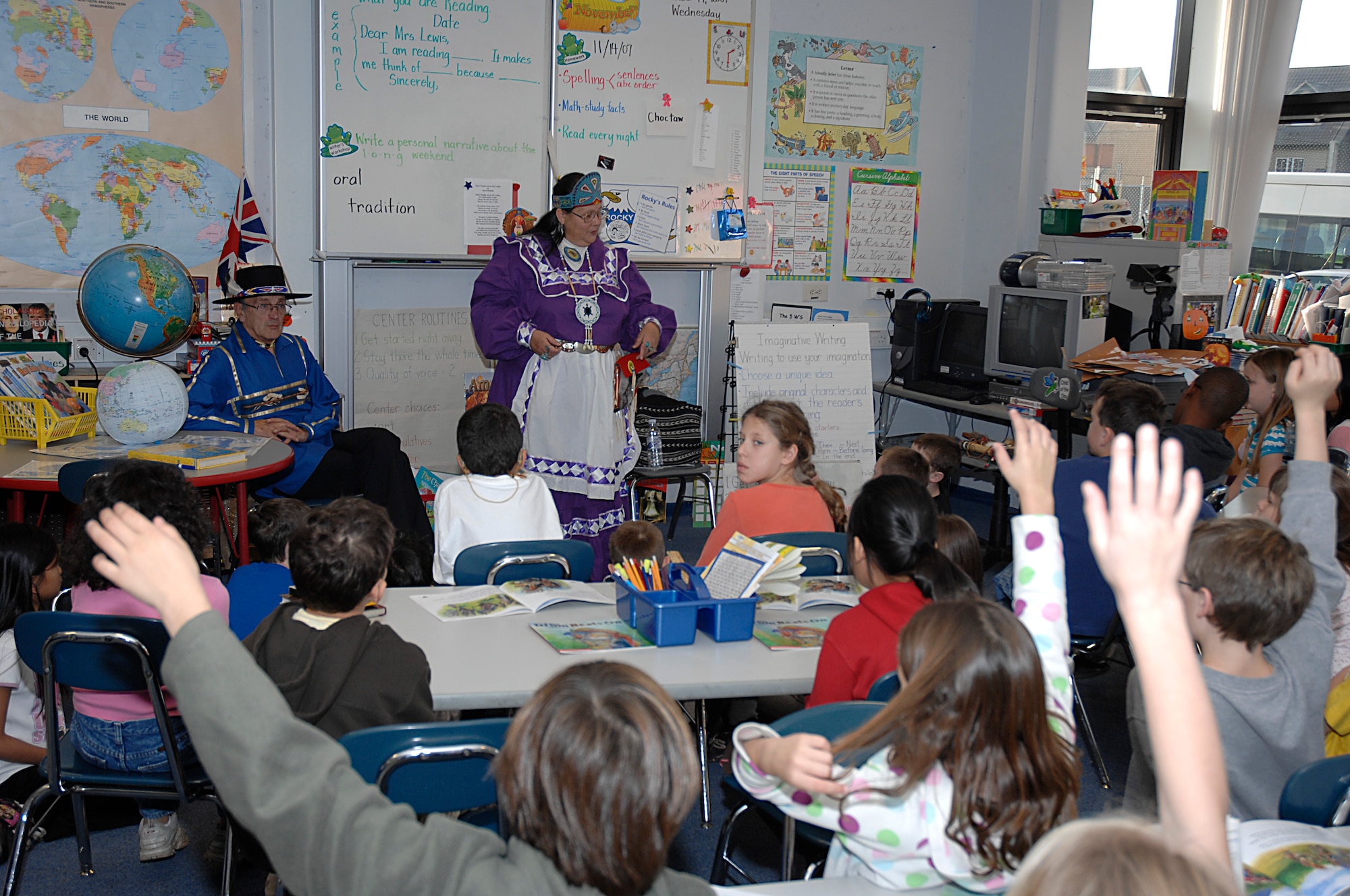 Anoli Wood, or Ohoyo Anoli Hekia her Choctaw name which means "Standing Storytelling Woman" spokes to the 2nd and 3rd graders at RAF Lakenheath Elementary school Nov. 14 about Native American Indian history and beliefs. Ms. Wood is wearing traditional Choctaw Indian clothing. (U.S. Air Force photo by Senior Airman Brian Ellis)