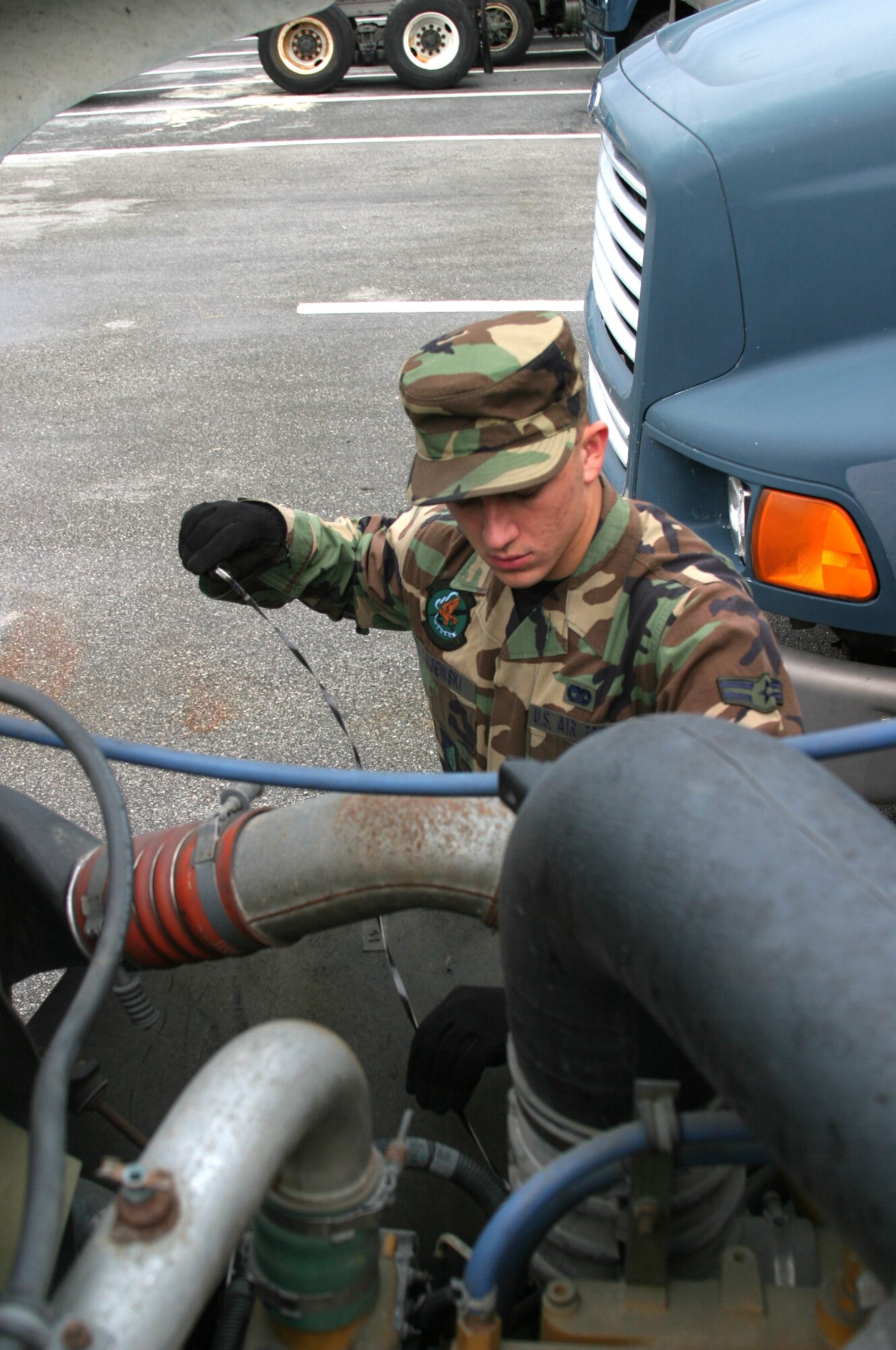 Airman 1st Class Richard Gajewski, 18th Logistics Readiness Squadron vehicle operator, checks the oil of a truck prior to a job. The vehicle operations flight conducts dispatch operations for the wing, supporting 60,000 transportation requests monthly.
(U.S. Air Force/Senior Airman Nestor Cruz)
