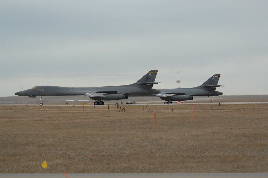 Two 37 Bomb Squadron B-1 Bombers taxi on the flight line as they prepare for take off Nov. 16 during the operational readiness inspection.  The inspection, which evaluates the base's war-time mission readiness, kicked off Nov. 14 at Ellsworth Air Force Base, S.D. (U.S. Air Force photo/Airman 1st Class Anthony Sanchelli)